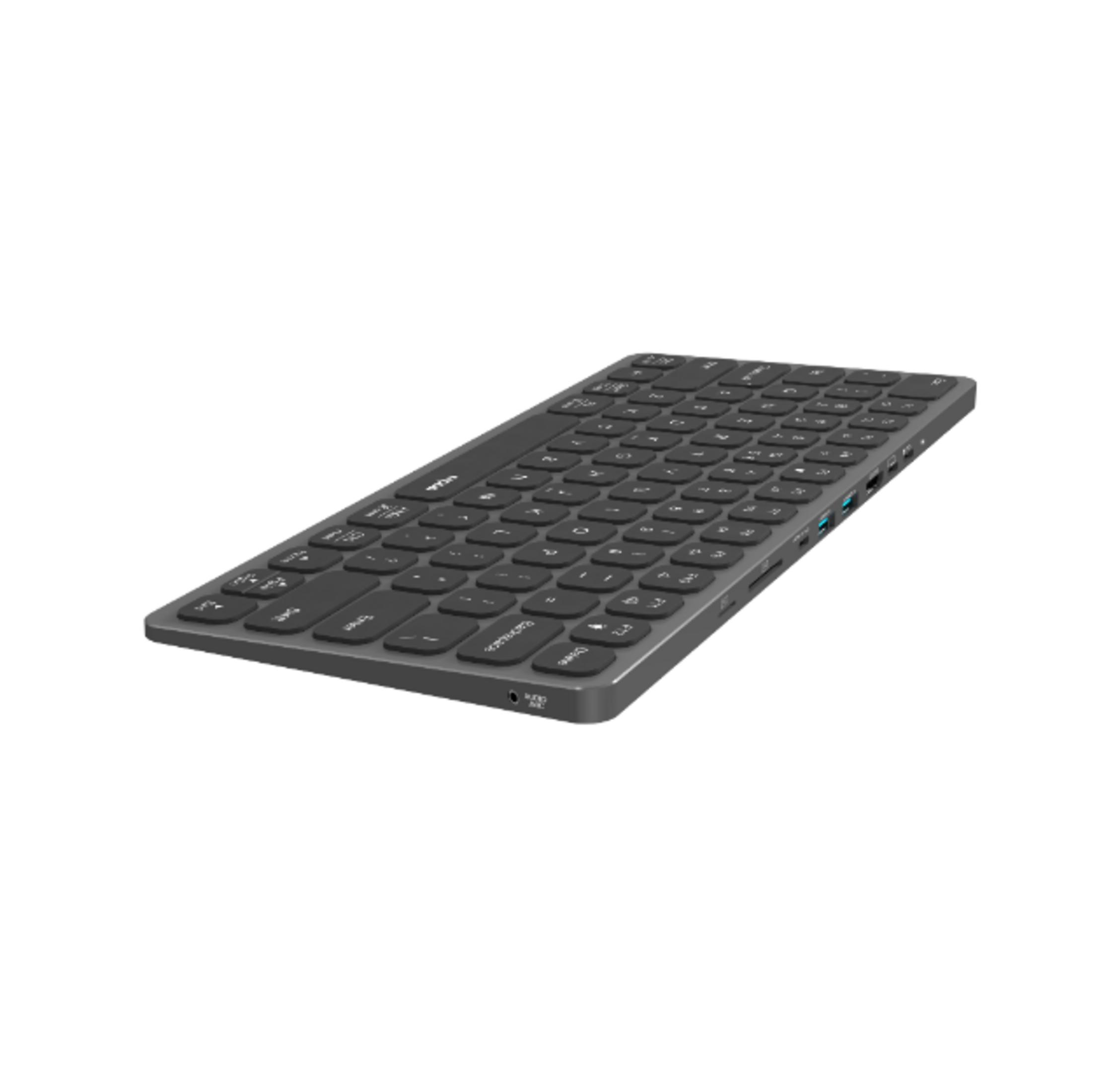 Teclado gris con puertos USB y conector de audio sobre fondo blanco.