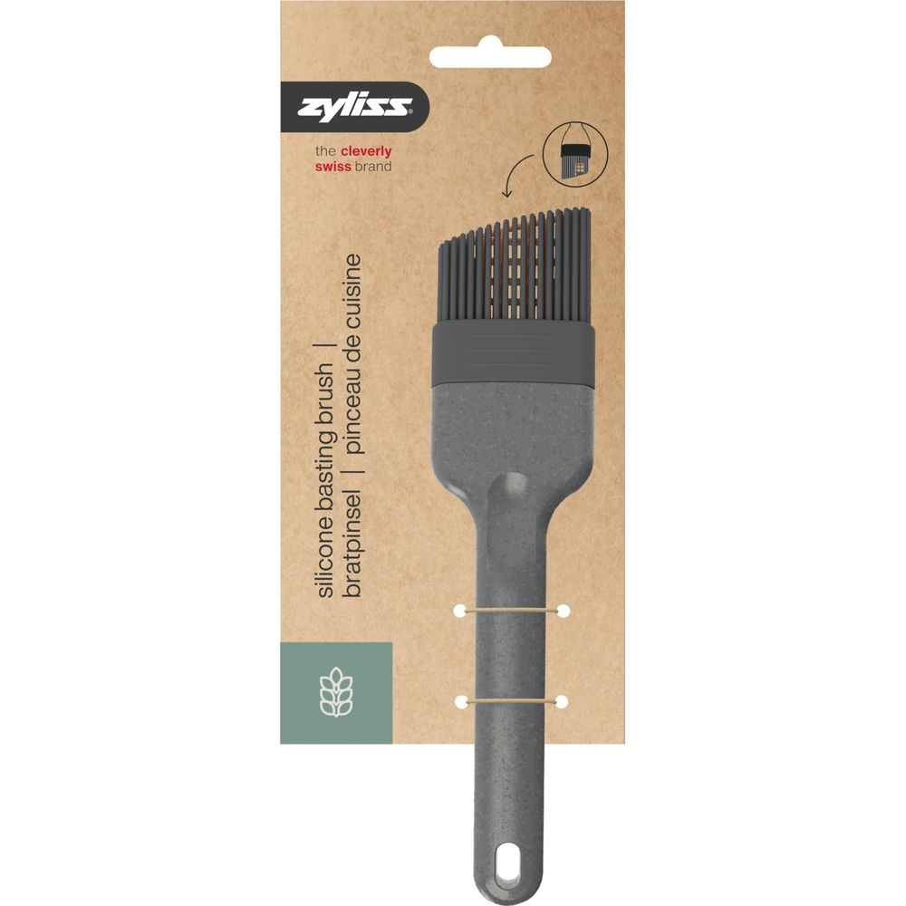Pennello Zyliss in silicone grigio con setole e anello per appenderlo.
