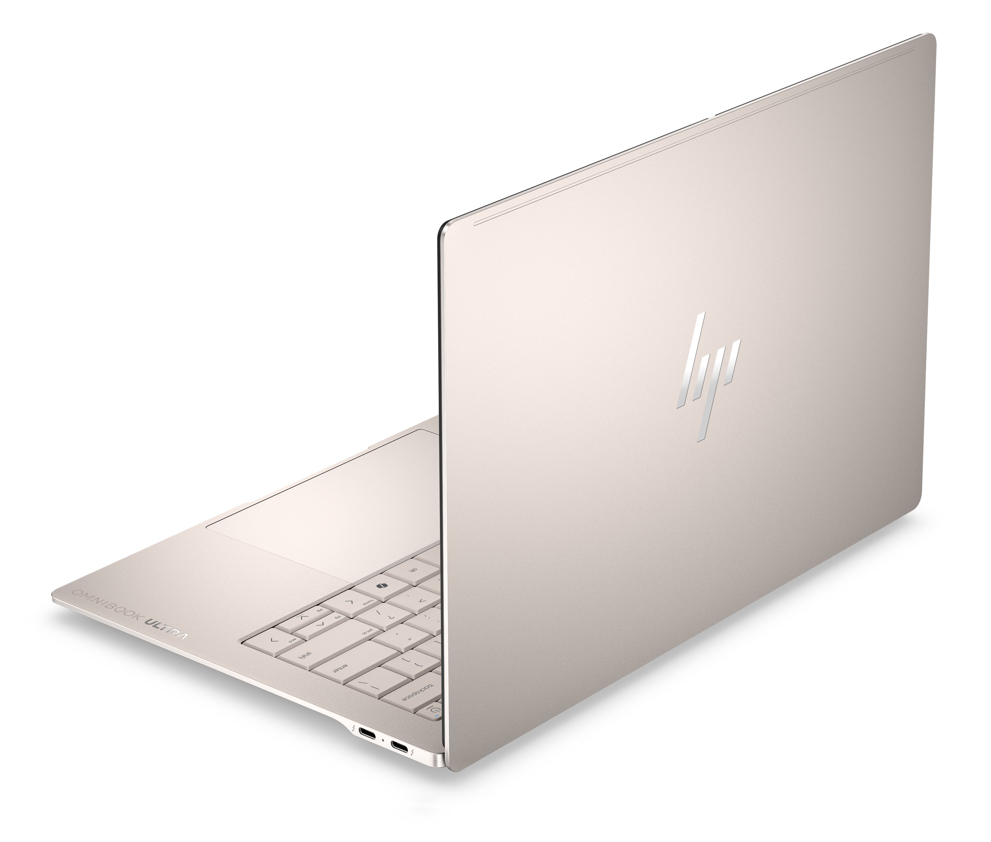 Un laptop aperto di colore chiaro con logo HP su coperchio e tastiera.
