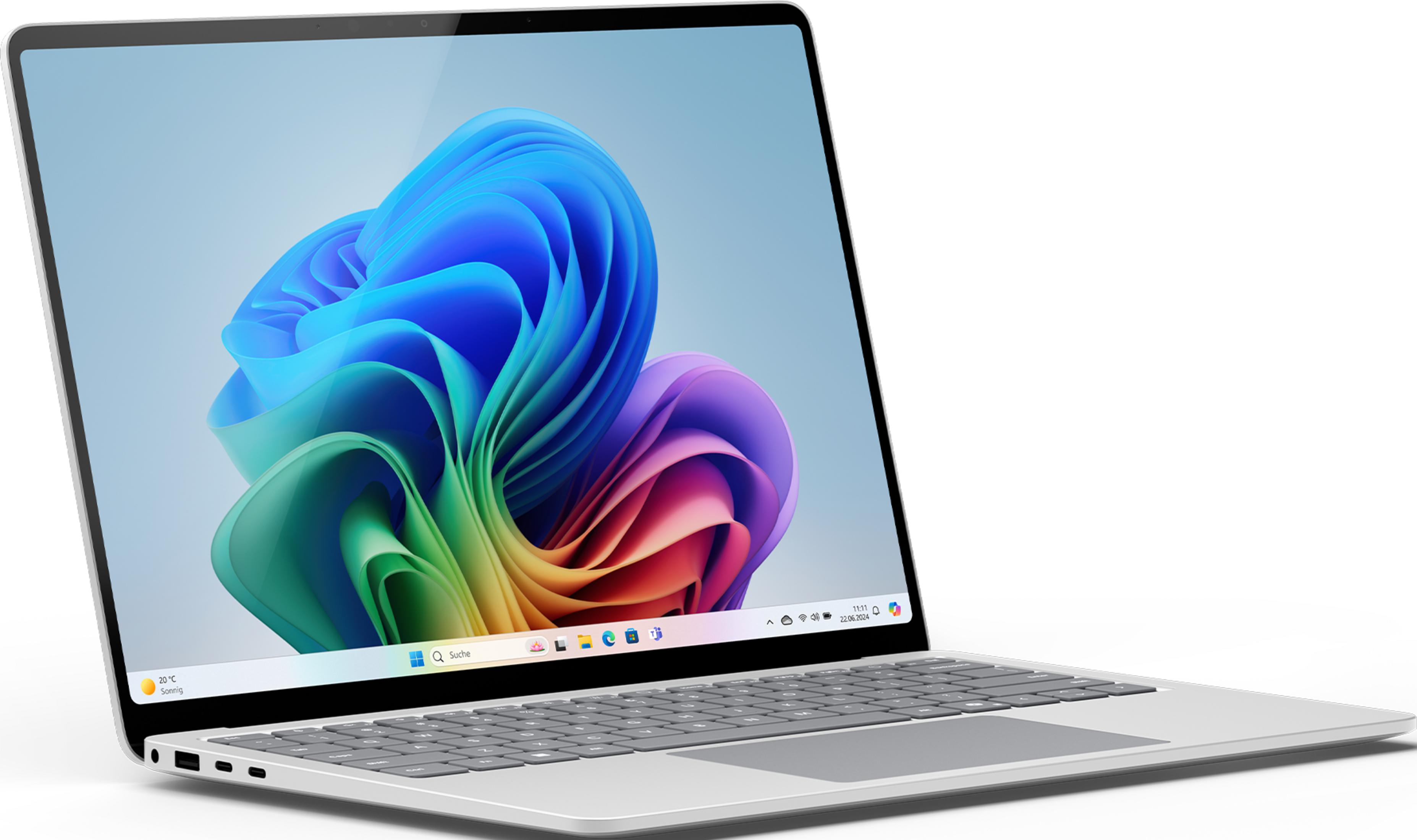 Ein geöffneter Laptop mit einem bunten Windows-Hintergrundbild und Tastatur.