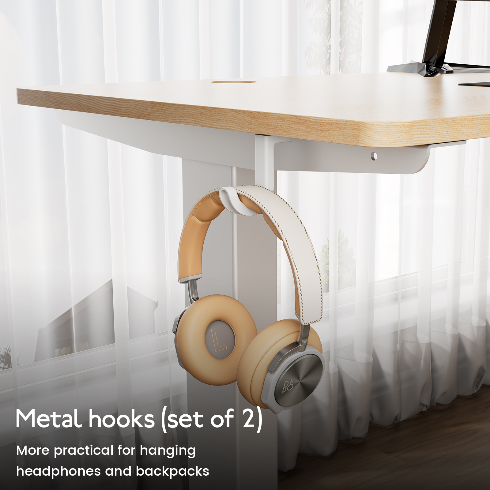 Tan and white headphones hang from a white desk hook. Metal hooks (set of 2) text.