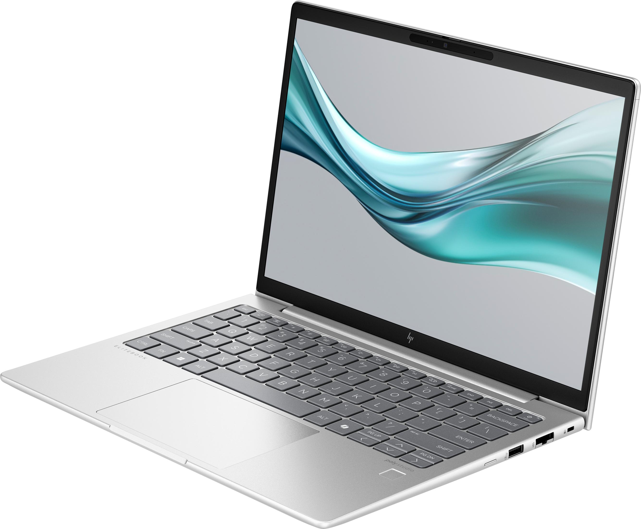Ein silberner Laptop mit einem geschwungenen blauen und grünen Muster auf dem Bildschirm.