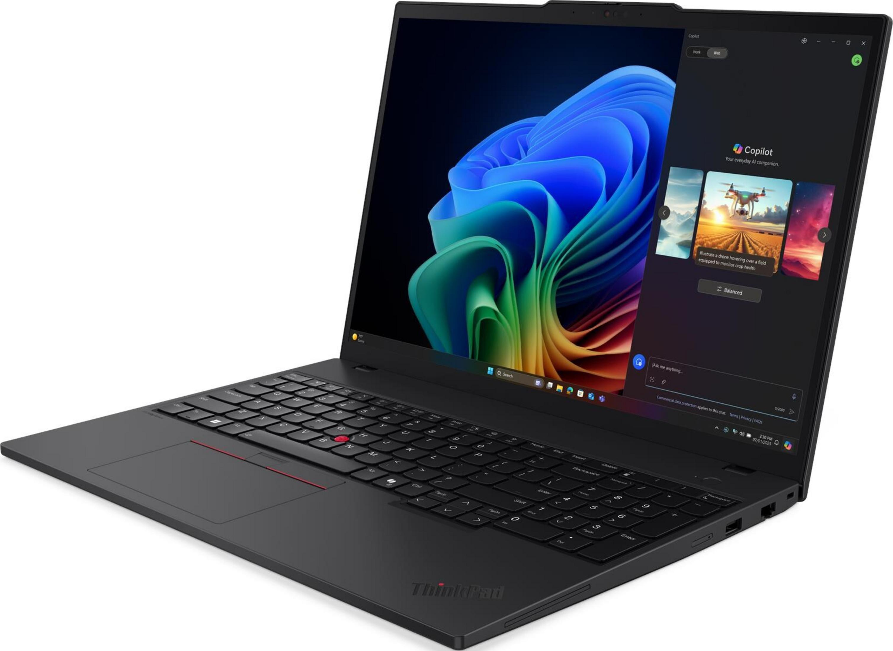 Czarny laptop wyświetlający kolorową abstrakcyjną tapetę na ekranie.