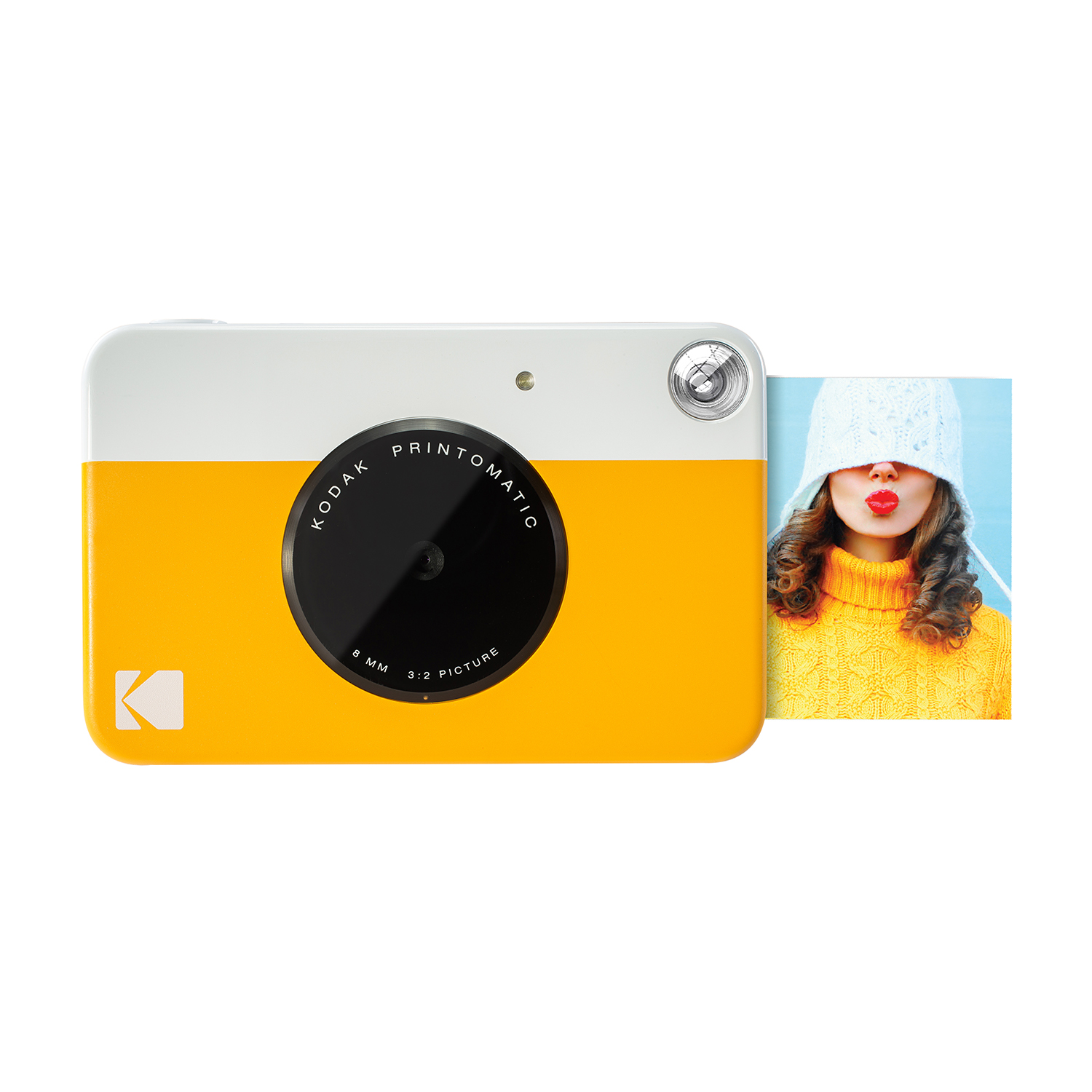 Żółto-biały aparat Kodak Printomatic ze zdjęciem kobiety w czapce i z ustami do całowania.