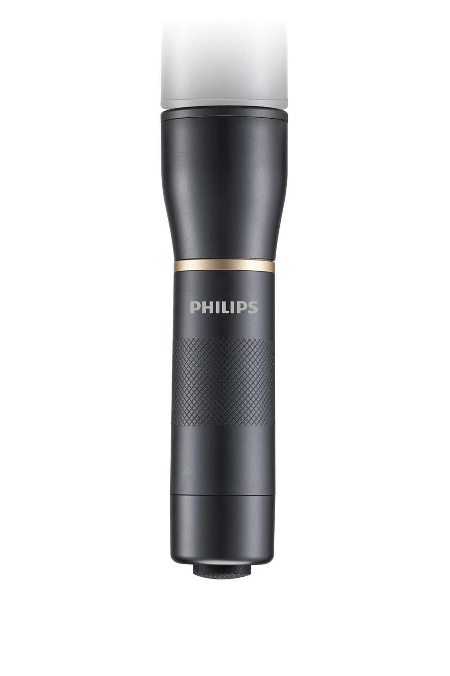 Ein schwarzer Philips-Rasierer mit einem goldenen Ring und einem weißen Aufsatz.