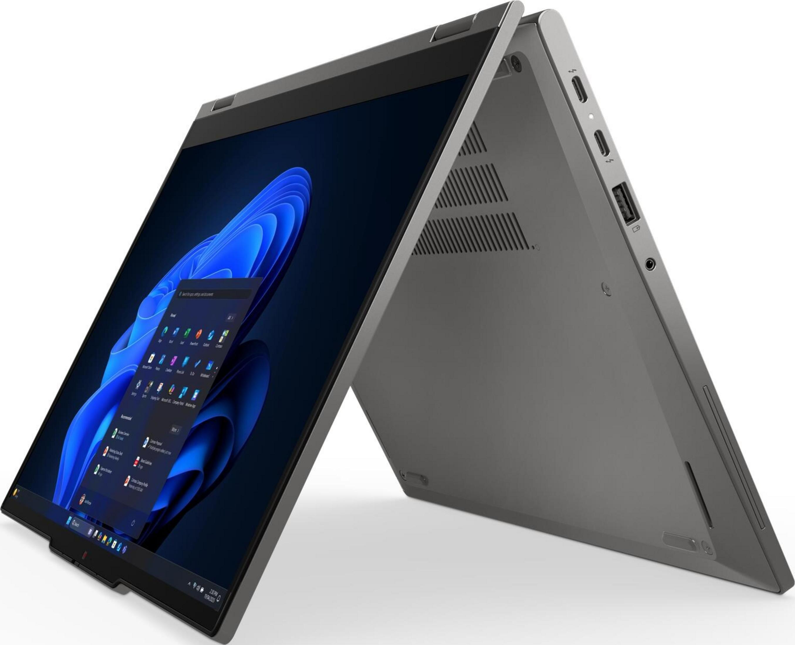 Ein graues Convertible-Notebook ist geöffnet und zeigt den Bildschirm mit der Windows 11-Oberfläche und Anschlüsse an der Seite.