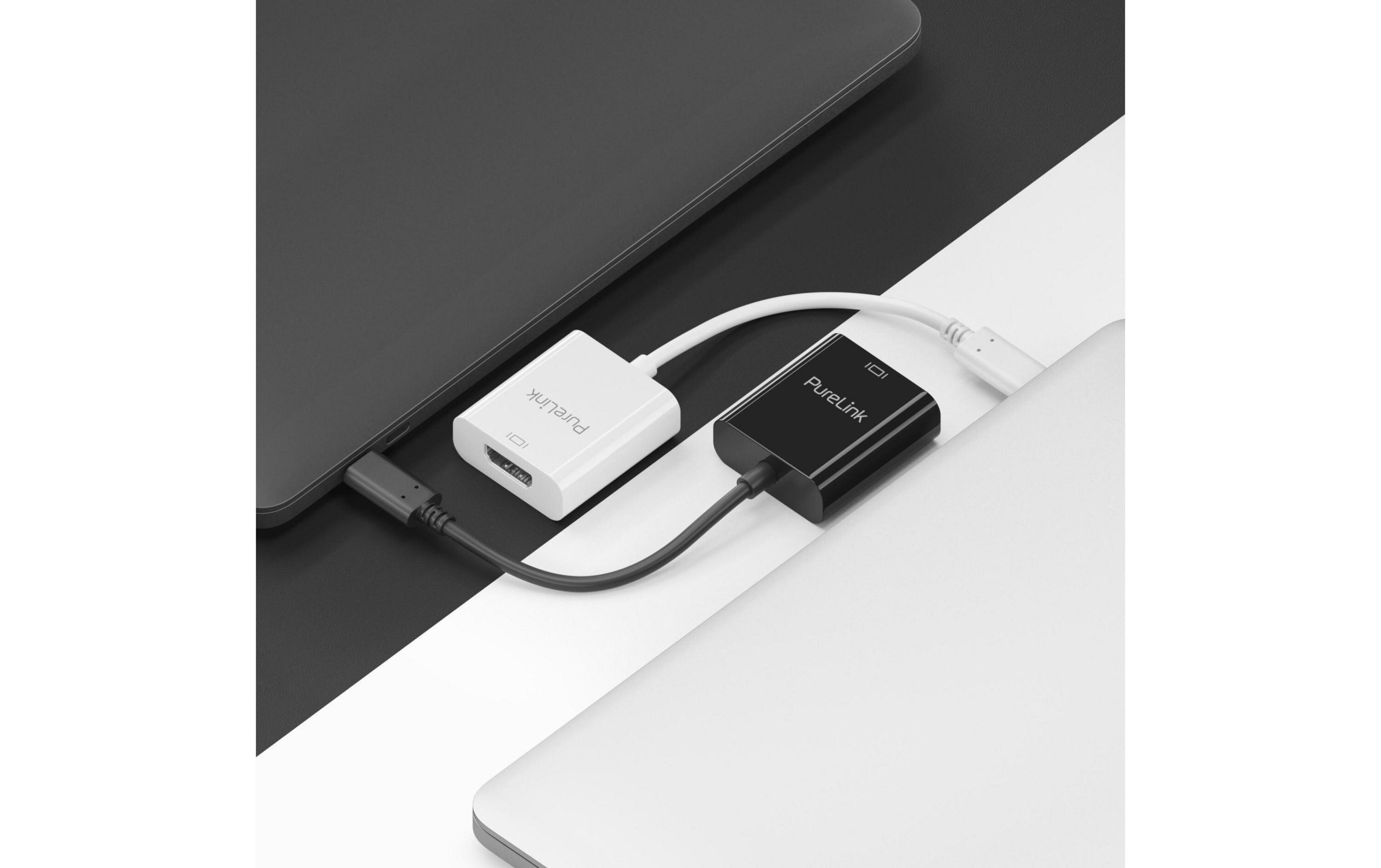 Dos adaptadores PureLink conectan portátiles con cables. Uno es blanco, el otro negro.