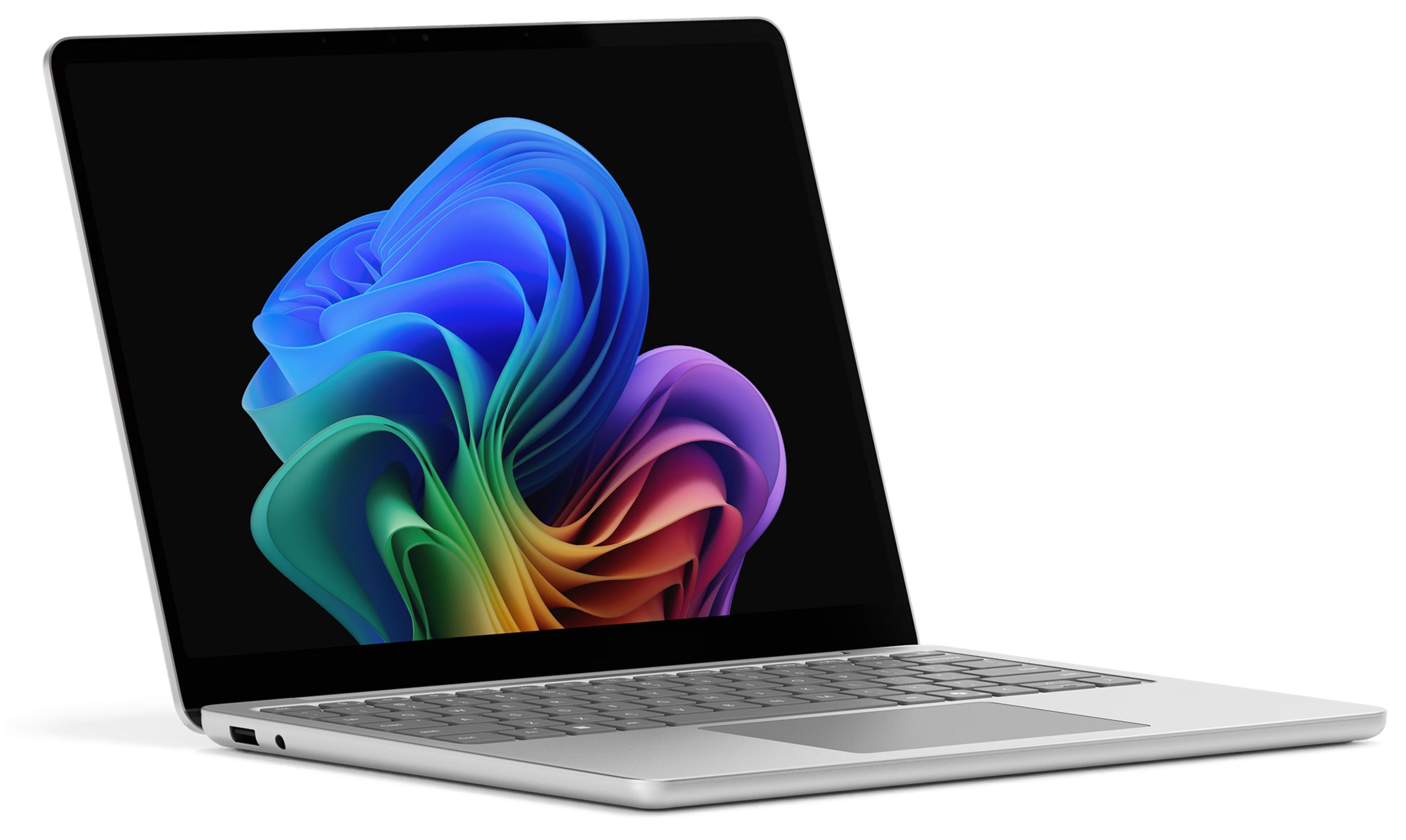 Ein silberner Laptop mit einem bunten, abstrakten Hintergrund auf dem Bildschirm.