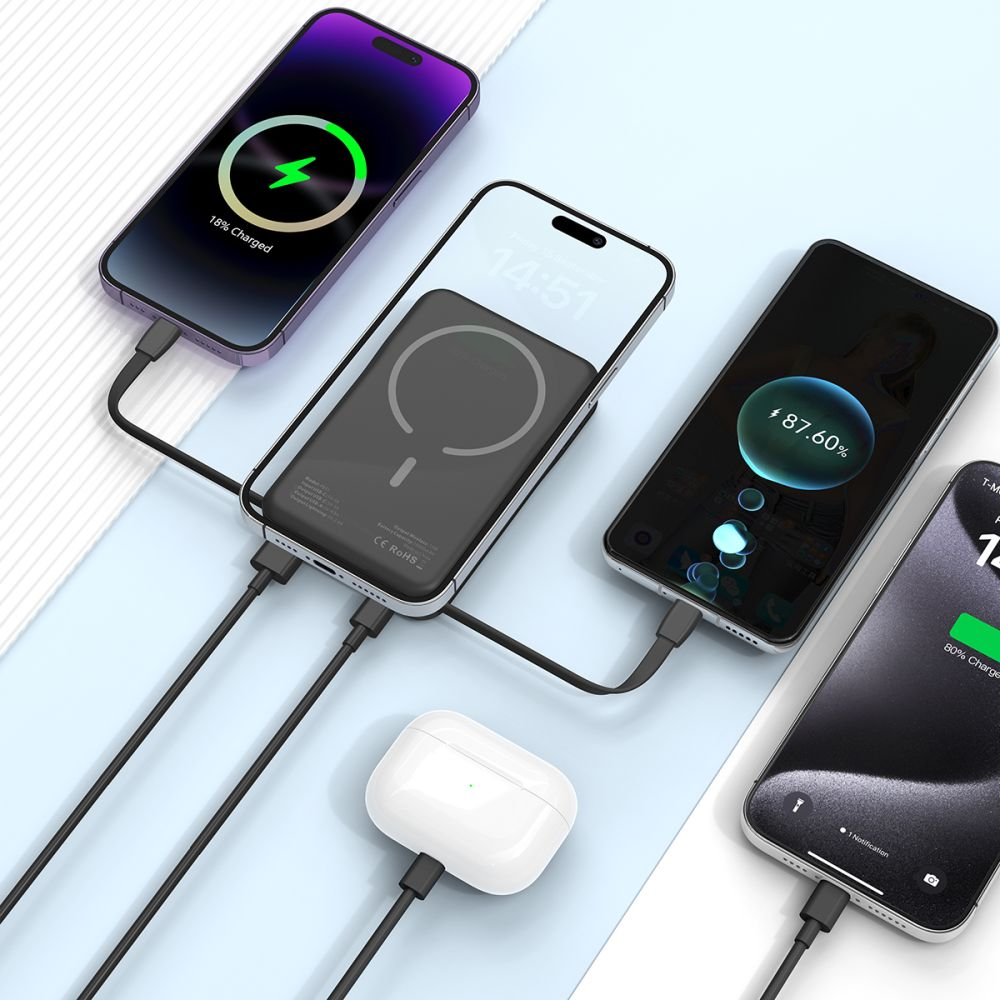 Vier Smartphones und AirPods werden über Kabel aufgeladen.