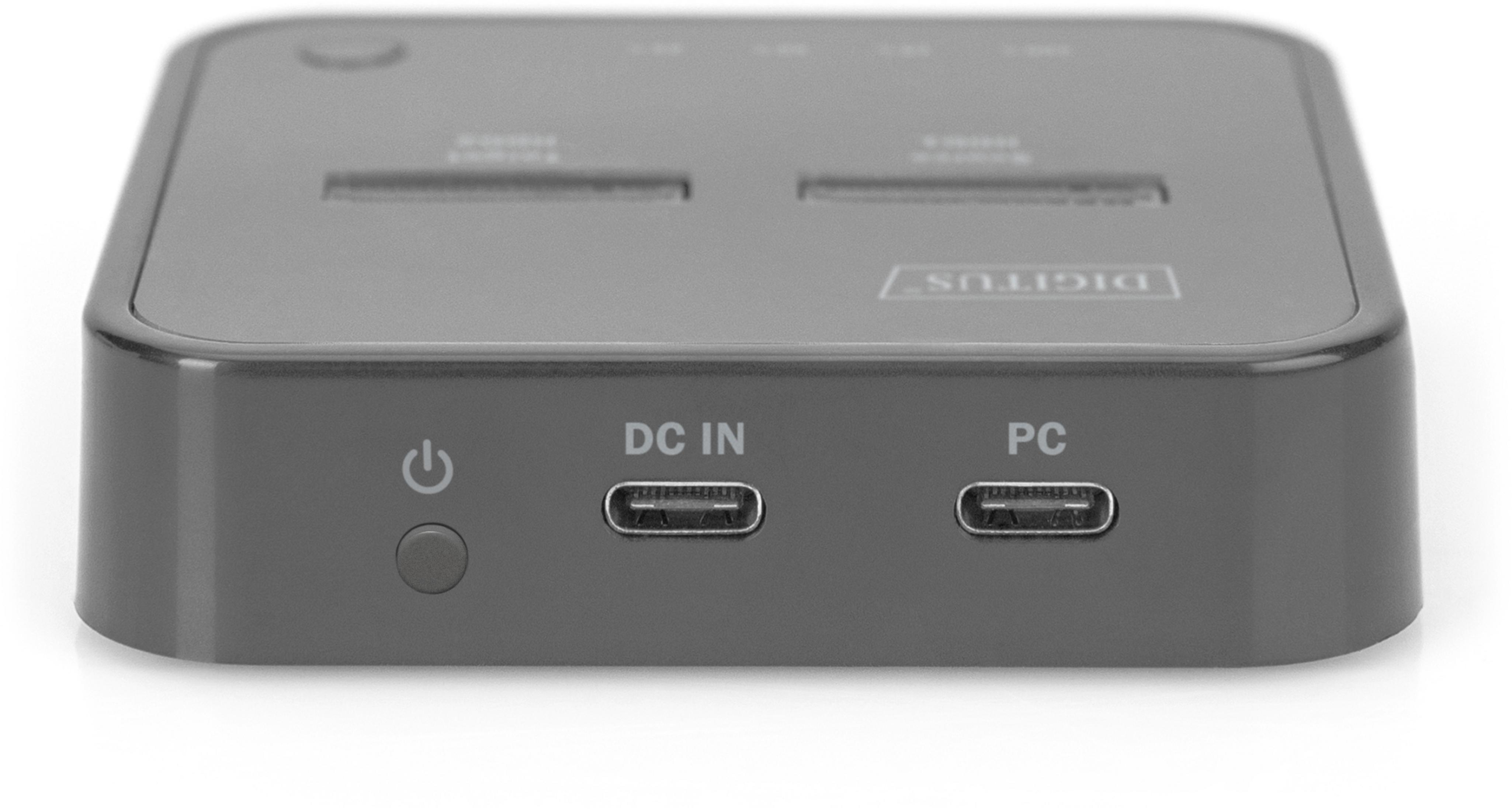 Grijs apparaat met aan/uit-knop, DC IN en PC USB-C poorten.