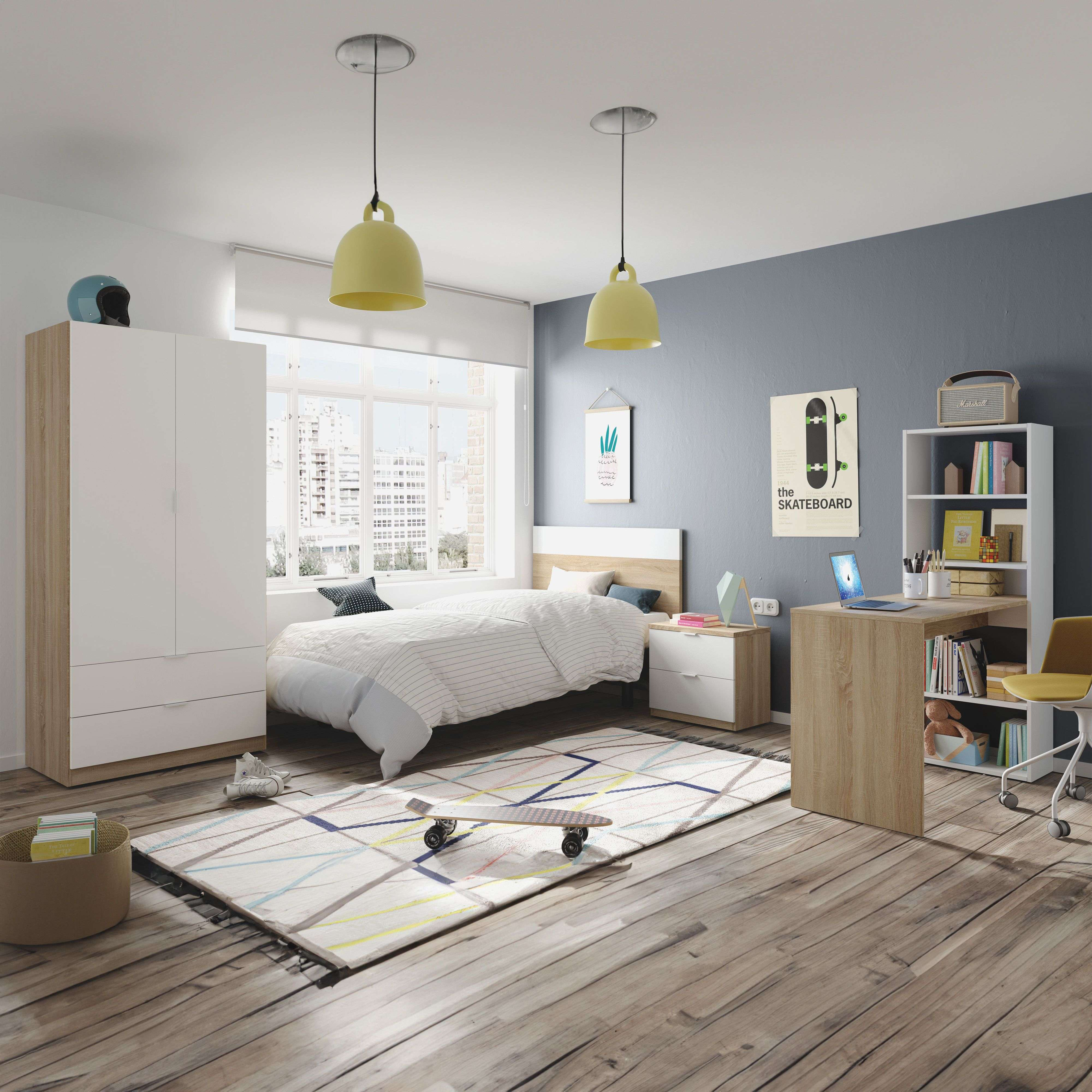Dormitorio moderno para adolescentes con cama, armario, escritorio y monopatín en la alfombra.