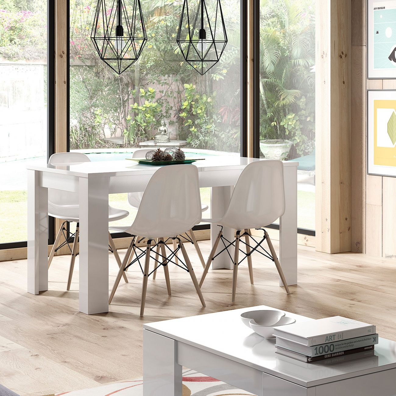 Una mesa de comedor blanca con cuatro sillas se encuentra frente a una gran ventana con vistas a un jardín.