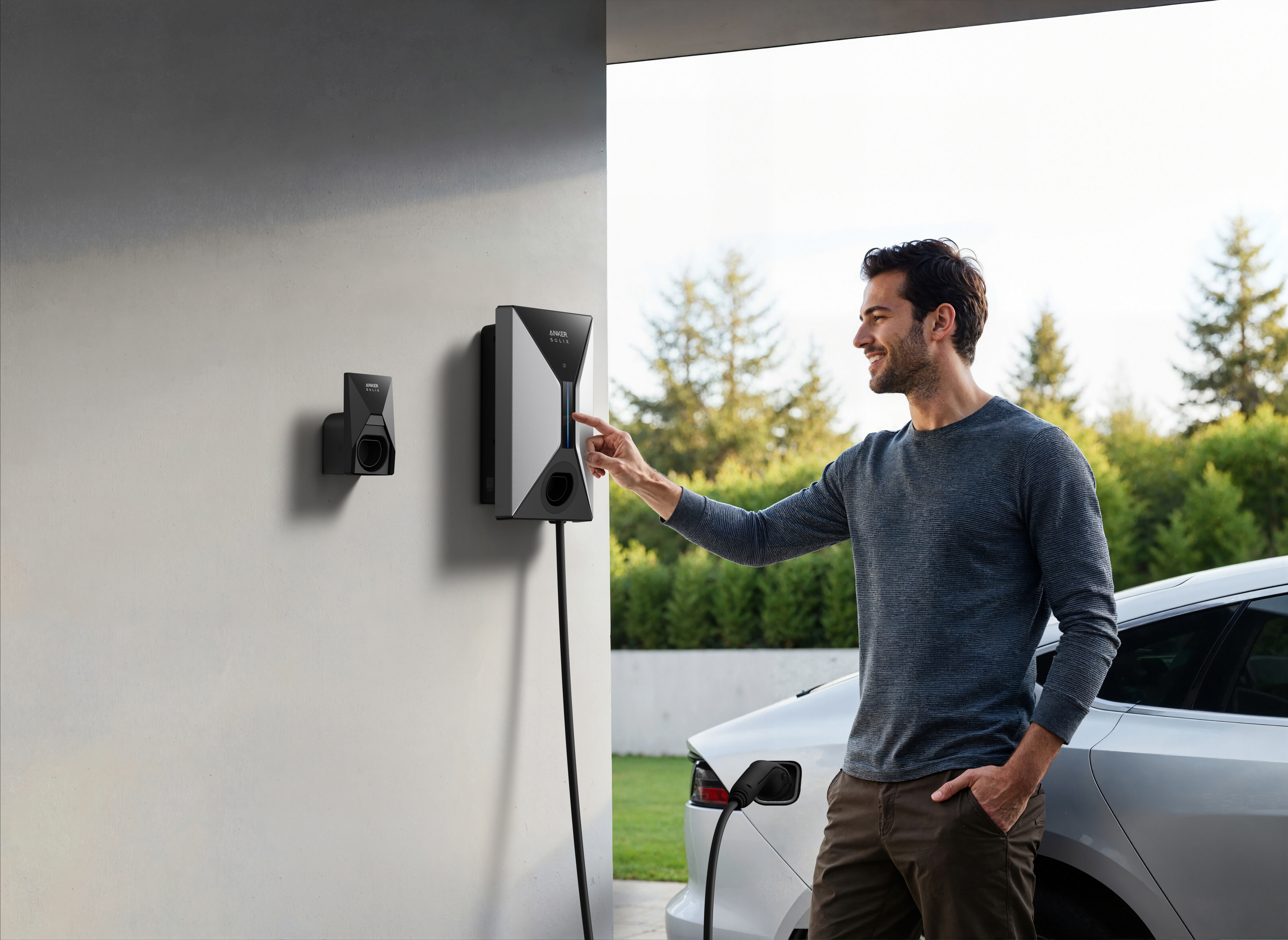 Homme touche chargeur voiture électrique sur mur à côté voiture blanche.
