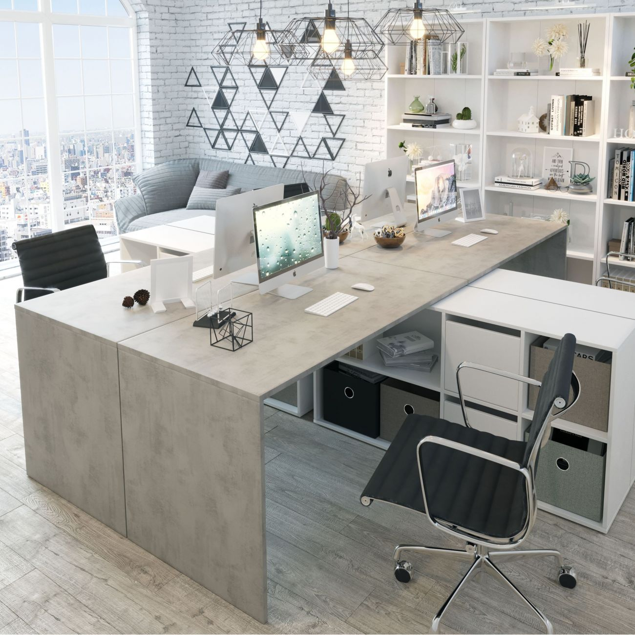 Oficina moderna con escritorio de hormigón, ordenadores, sillas, sofá y estanterías.