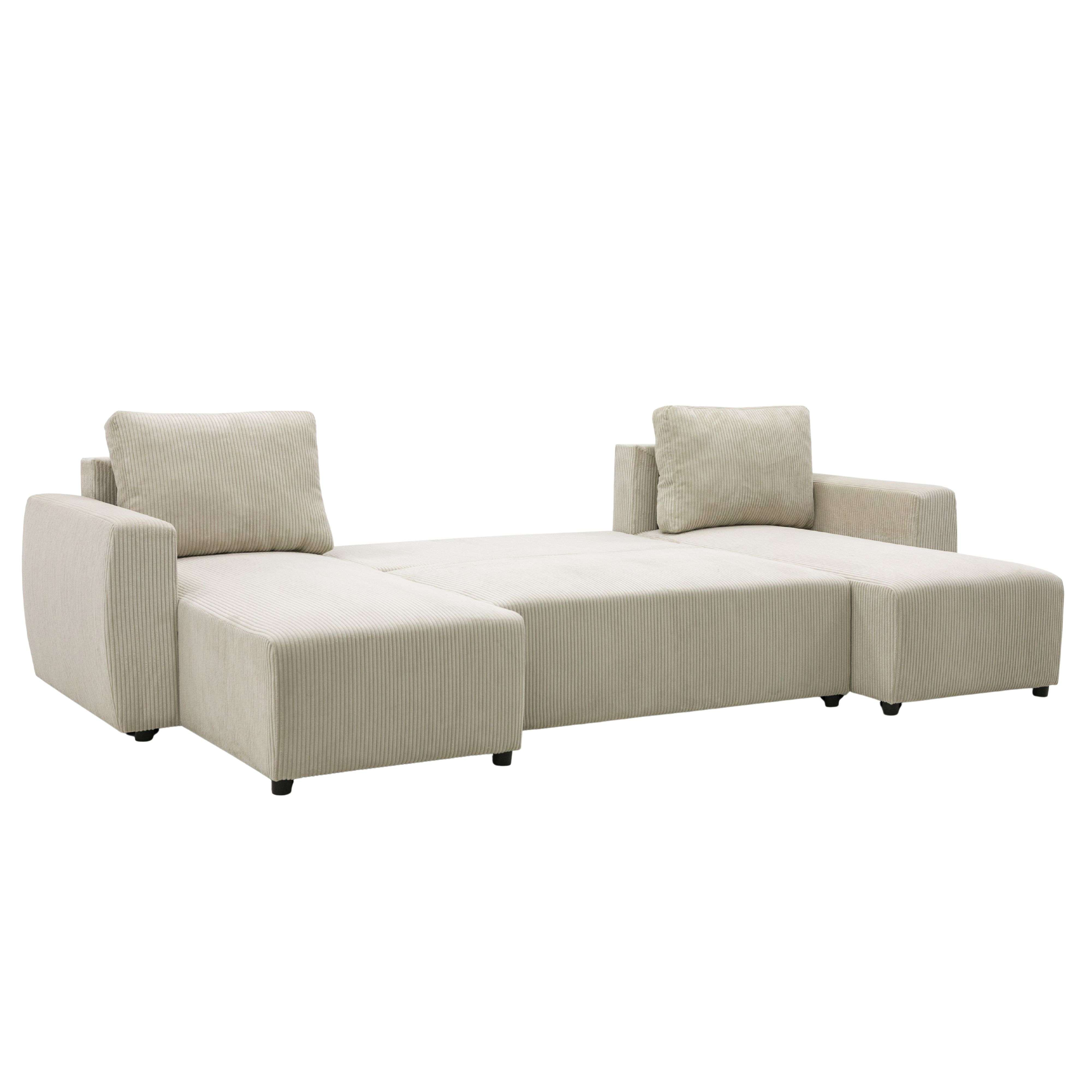 Un sofá de pana beige, extendido como cama, con dos cojines.
