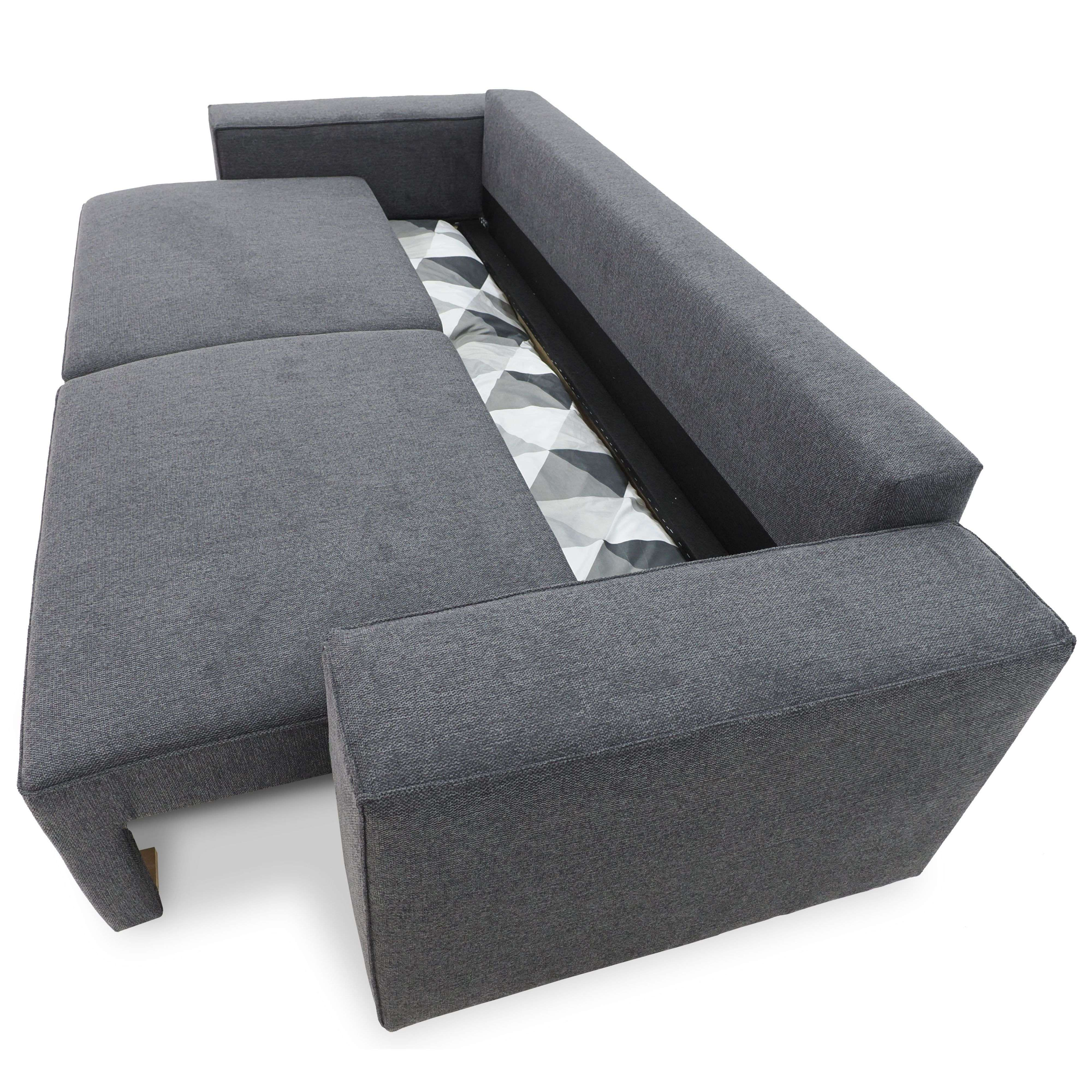 Sofá cama gris con patrón geométrico debajo.