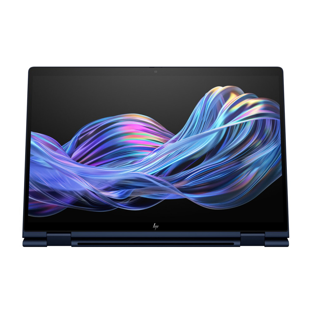 Otwarty ciemnoniebieski laptop wyświetlający abstrakcyjny, falisty wygaszacz ekranu.