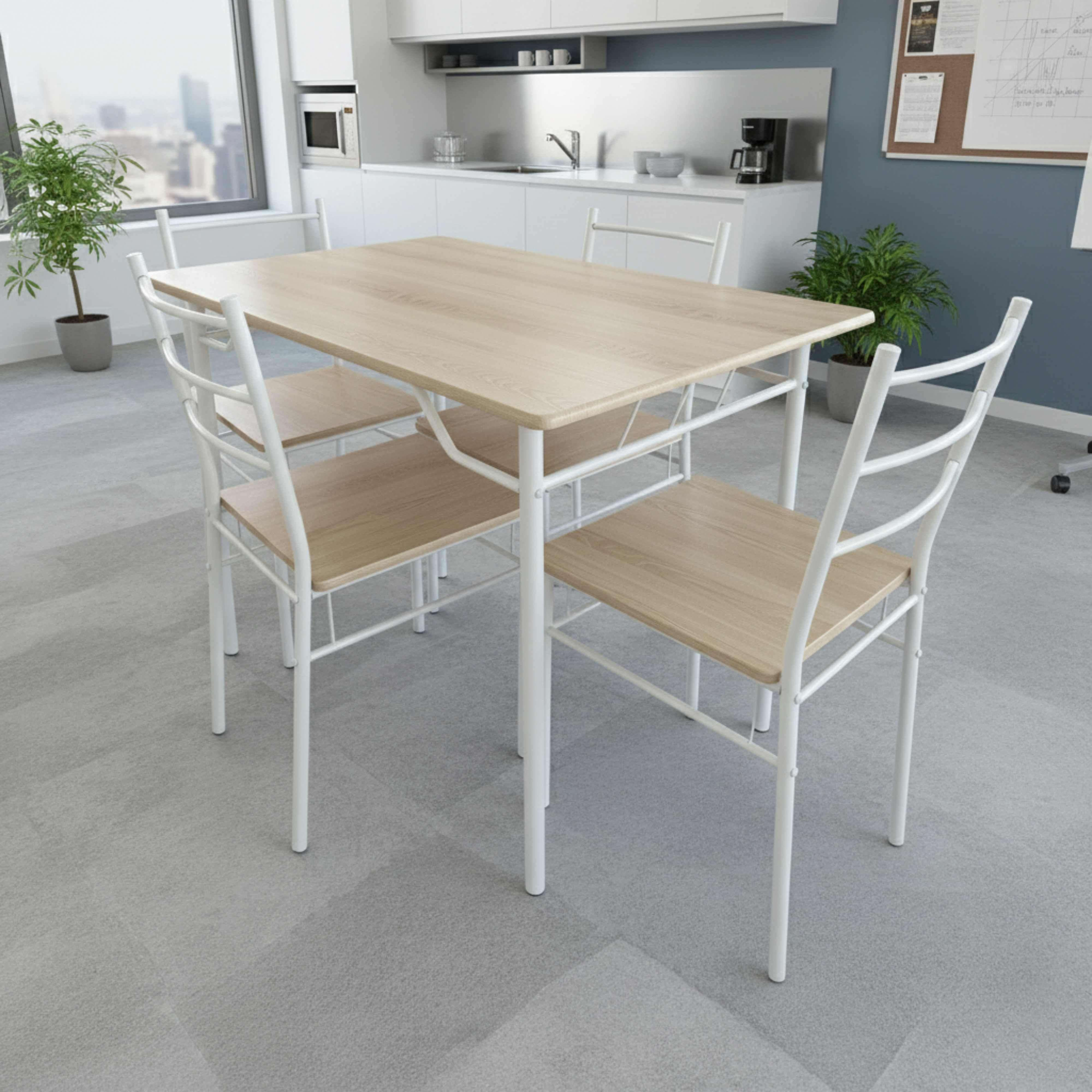Una mesa de madera con cuatro sillas blancas en una oficina con cocina.