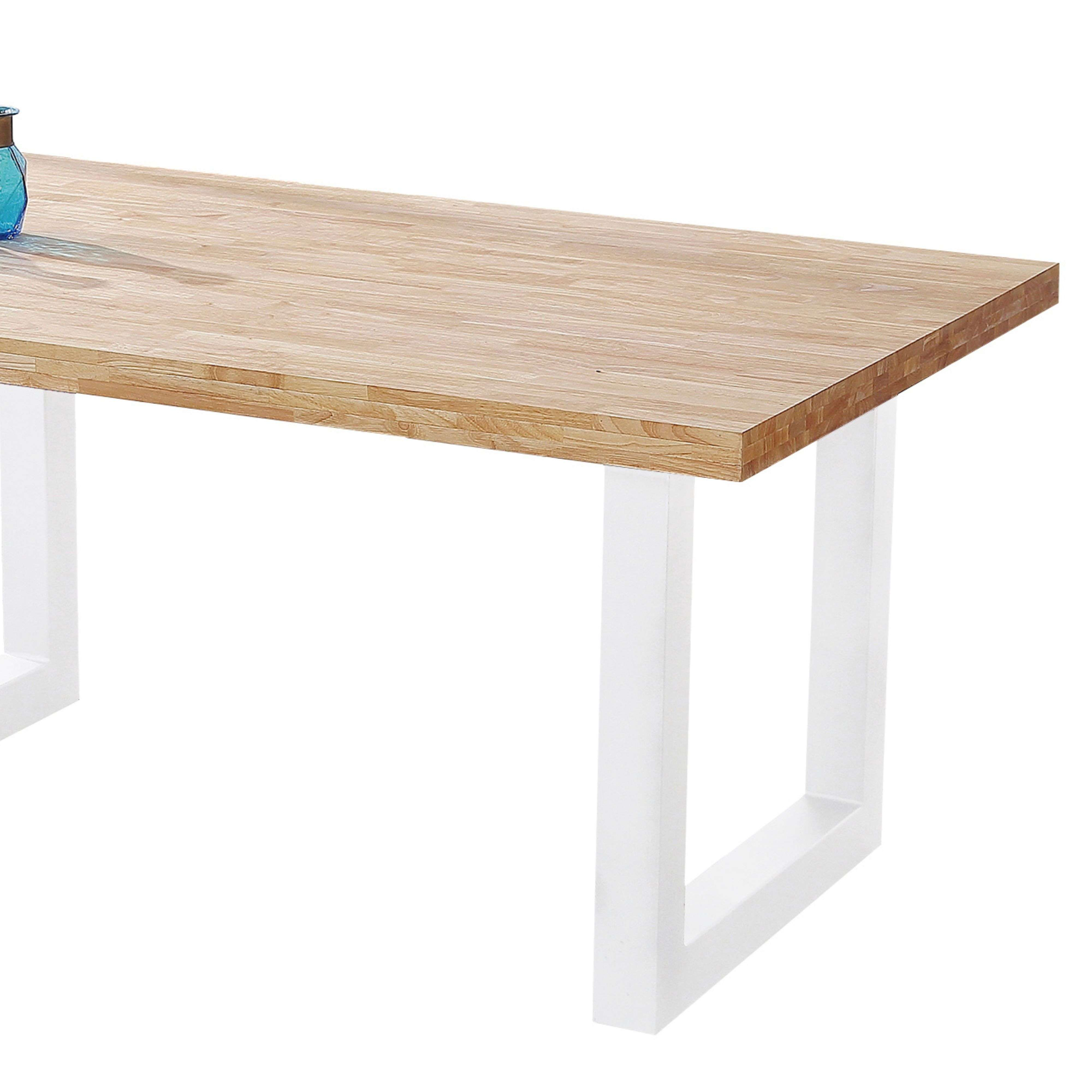 Mesa de madera con patas de metal blancas. Un jarrón azul sobre la mesa.