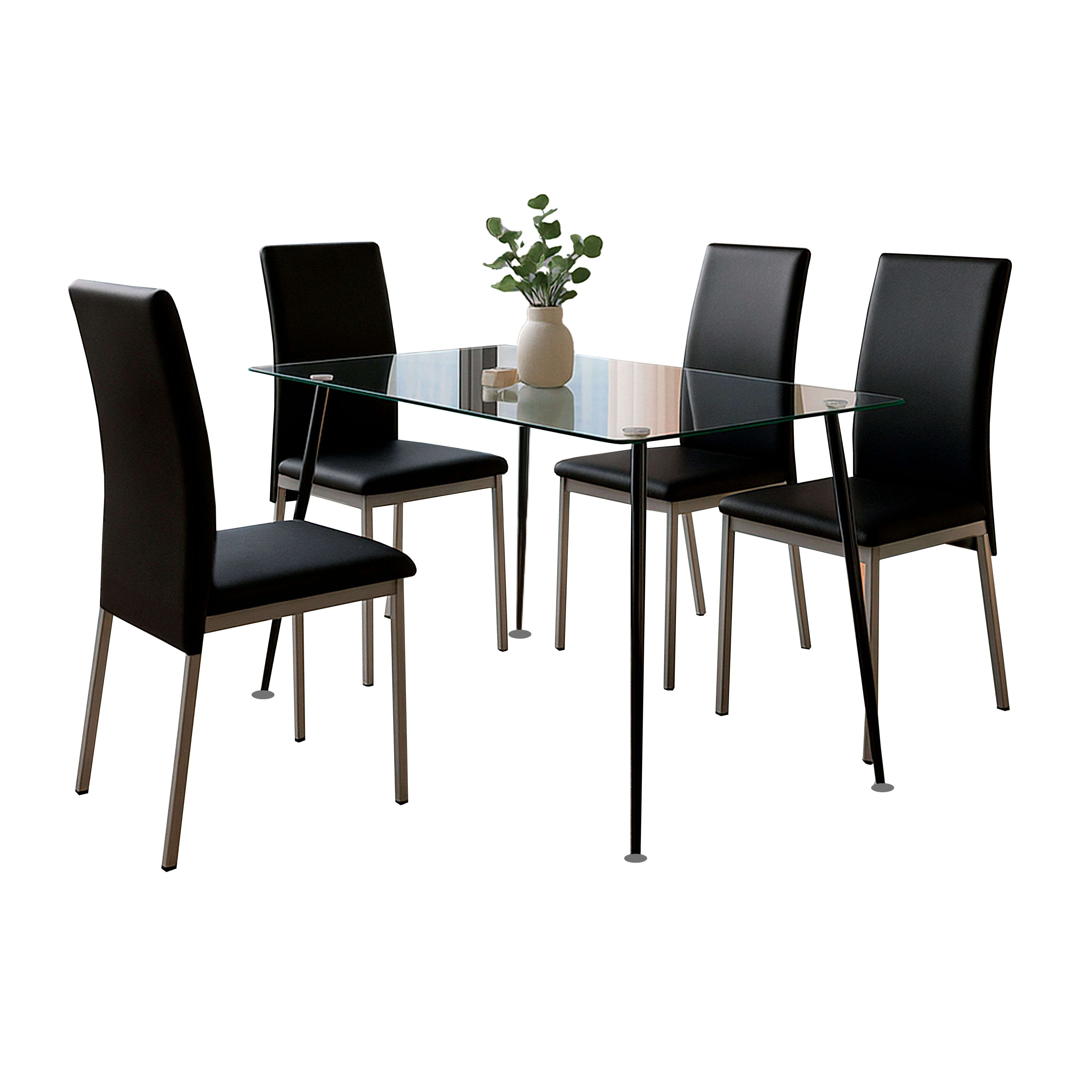 Una mesa de cristal con cuatro sillas negras y un jarrón con hojas.