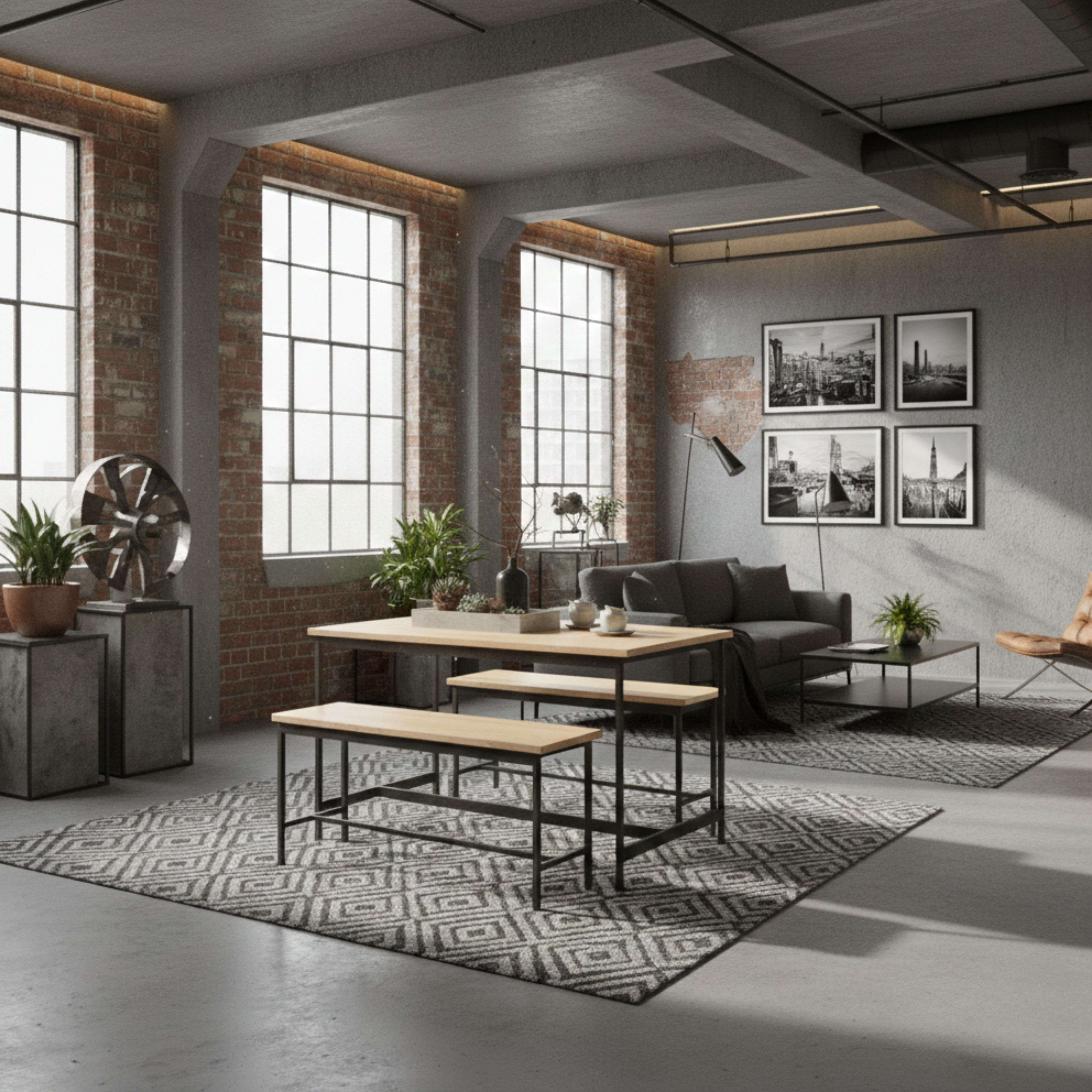 Sala de estar tipo loft con paredes de ladrillo, mesa de madera, bancos, sofá y cuadros.