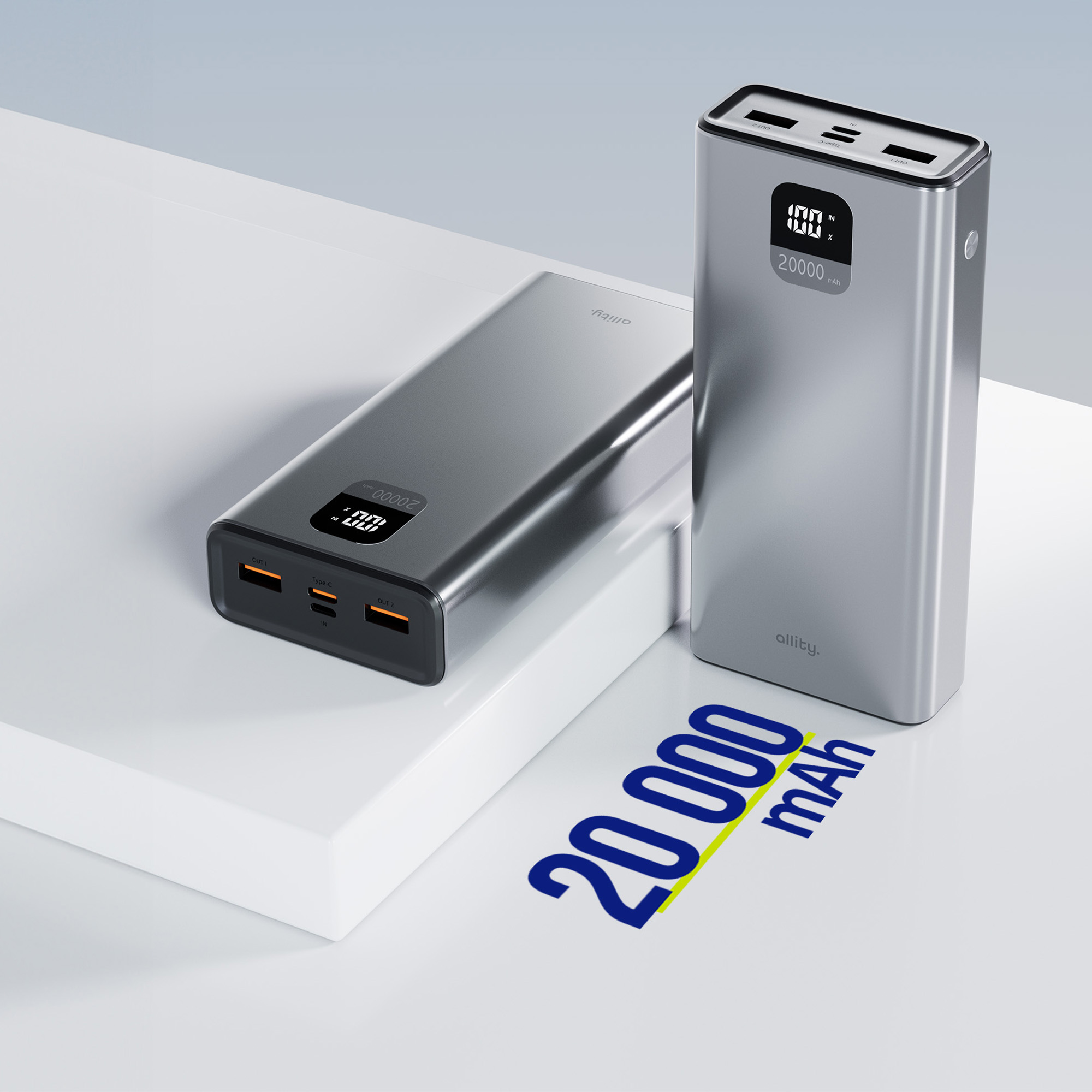 Due power bank argentate da 20.000 mAh riposano su un piedistallo bianco.