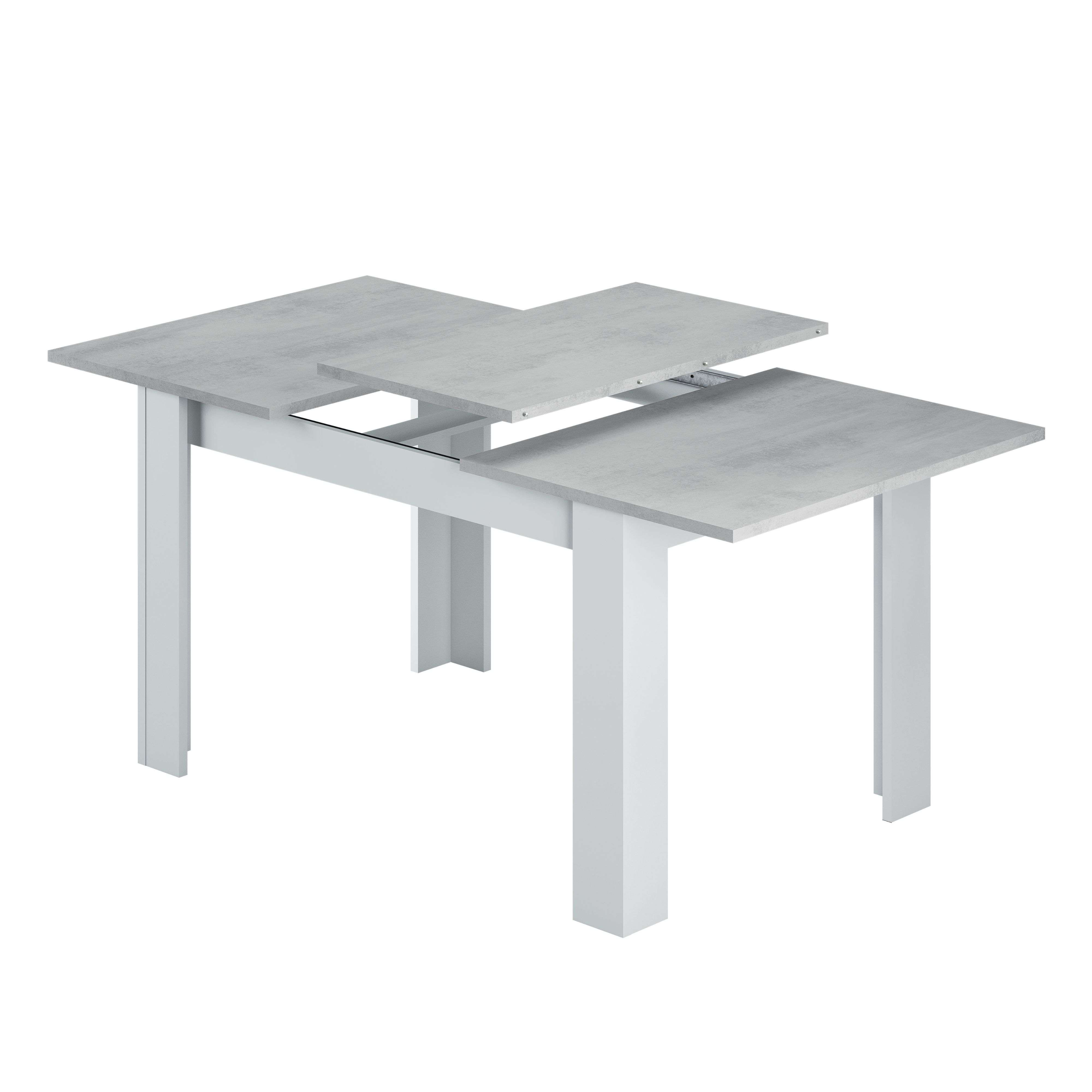 Una mesa extensible con superficie gris efecto hormigón y patas blancas.