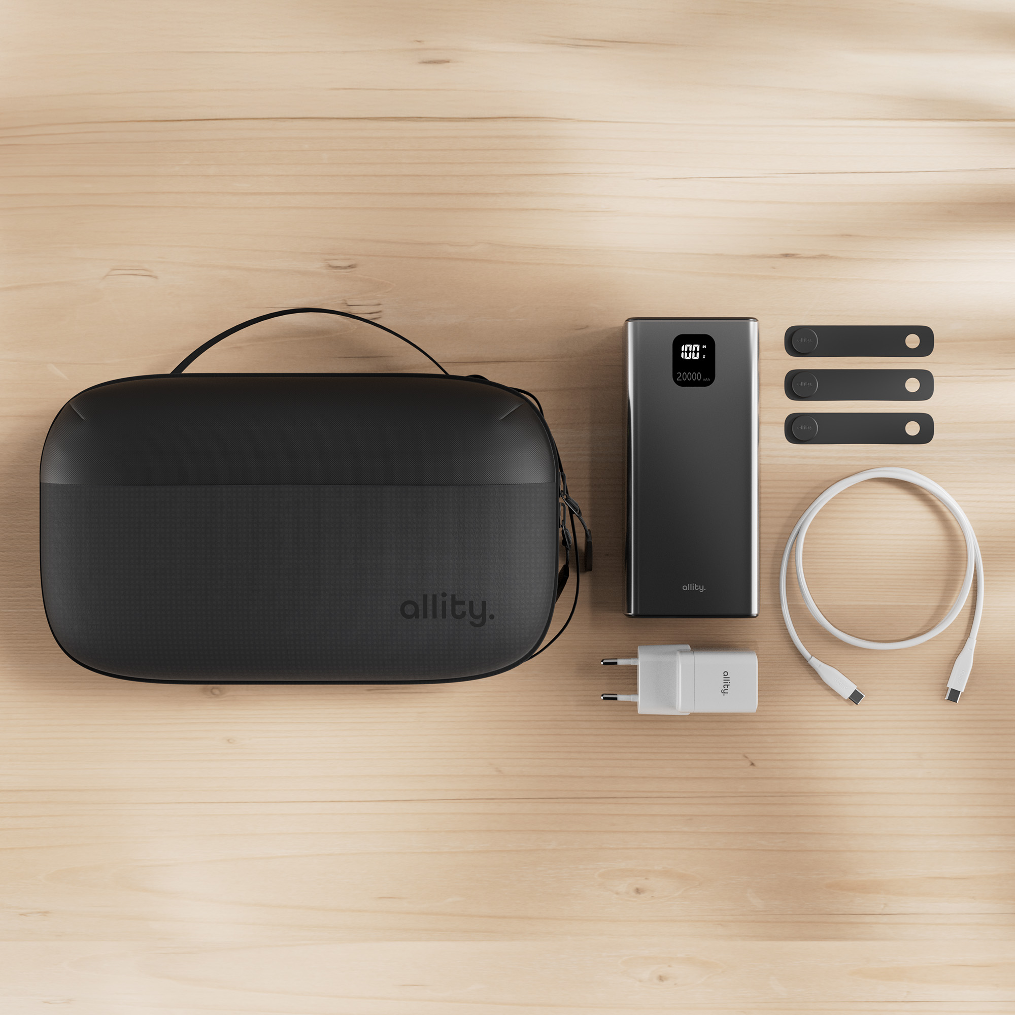 Una custodia nera, power bank, caricabatterie, cavo e tre cinghie nere.
