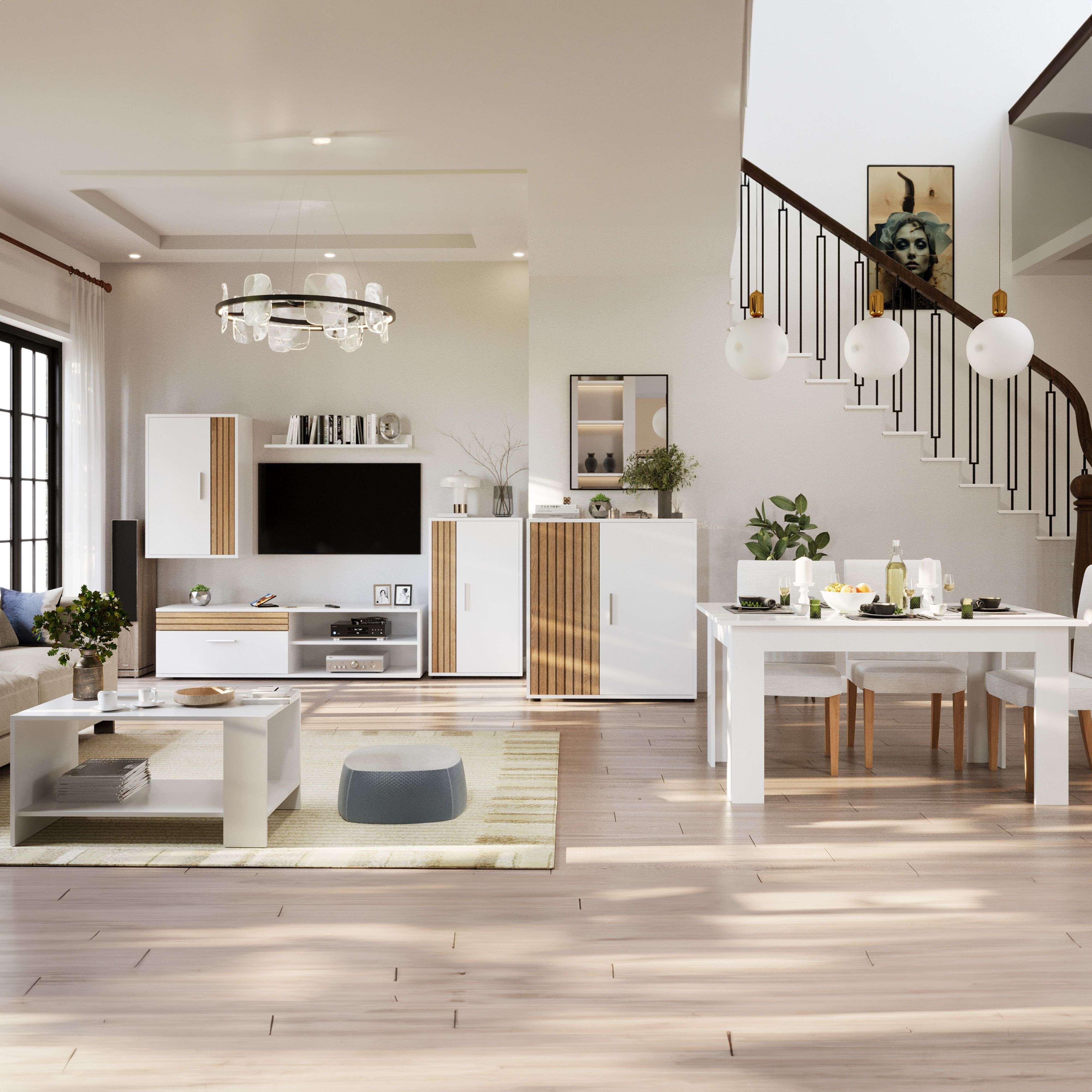 Sala de estar moderna con comedor, mesa blanca, sillas blancas y escalera.
