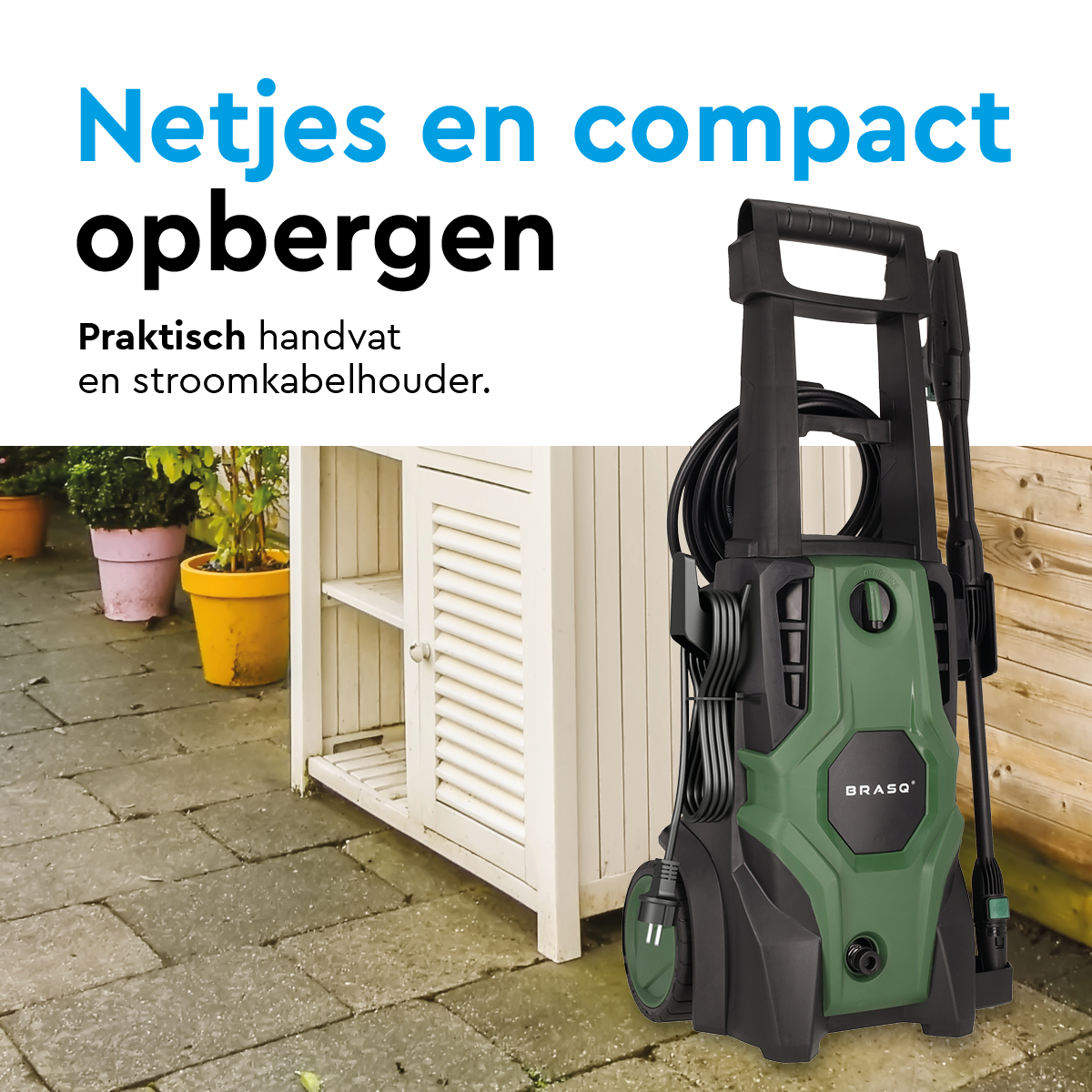 Groene hogedrukreiniger naast witte kast en planten.
