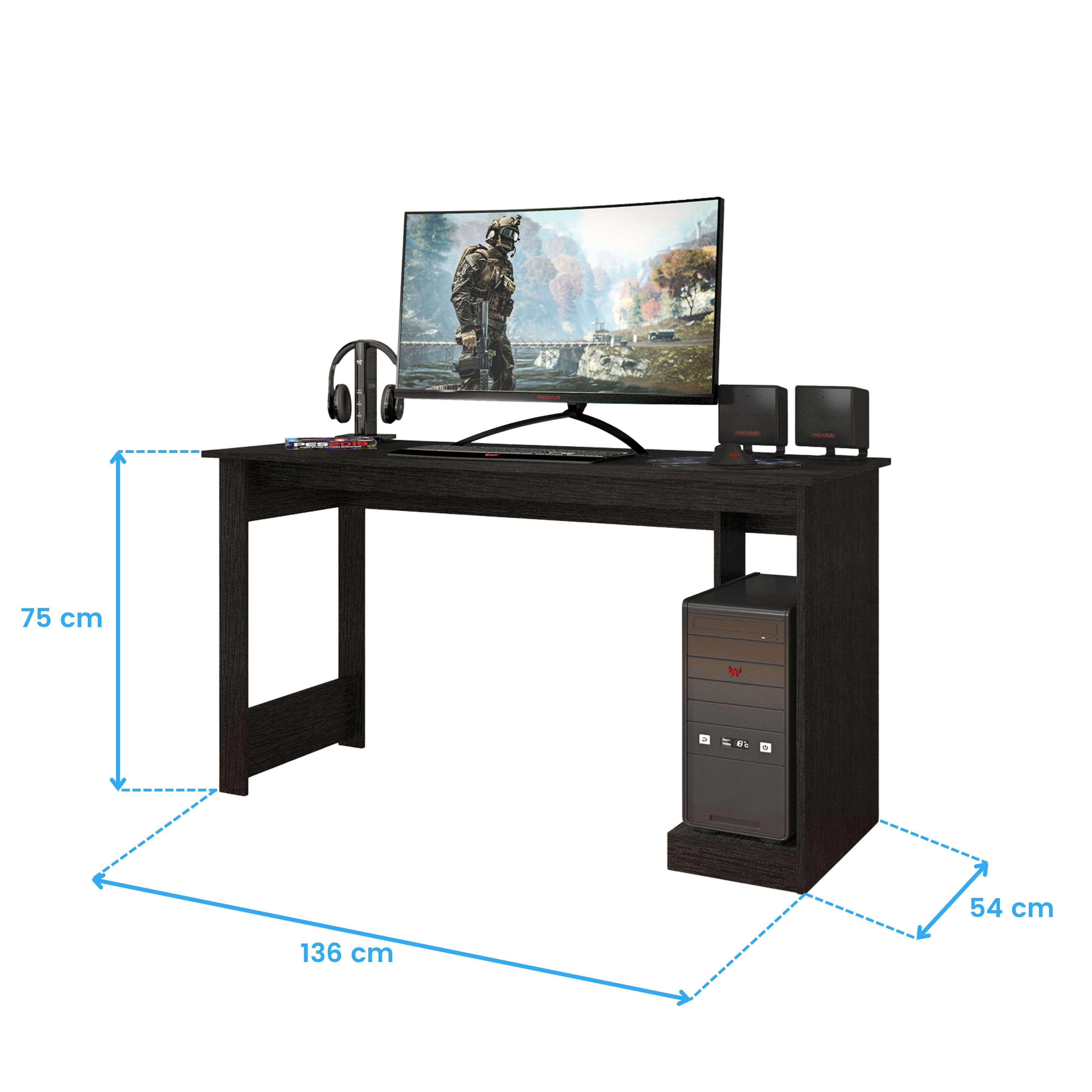 Un escritorio negro con PC, monitor, teclado, altavoces y auriculares.