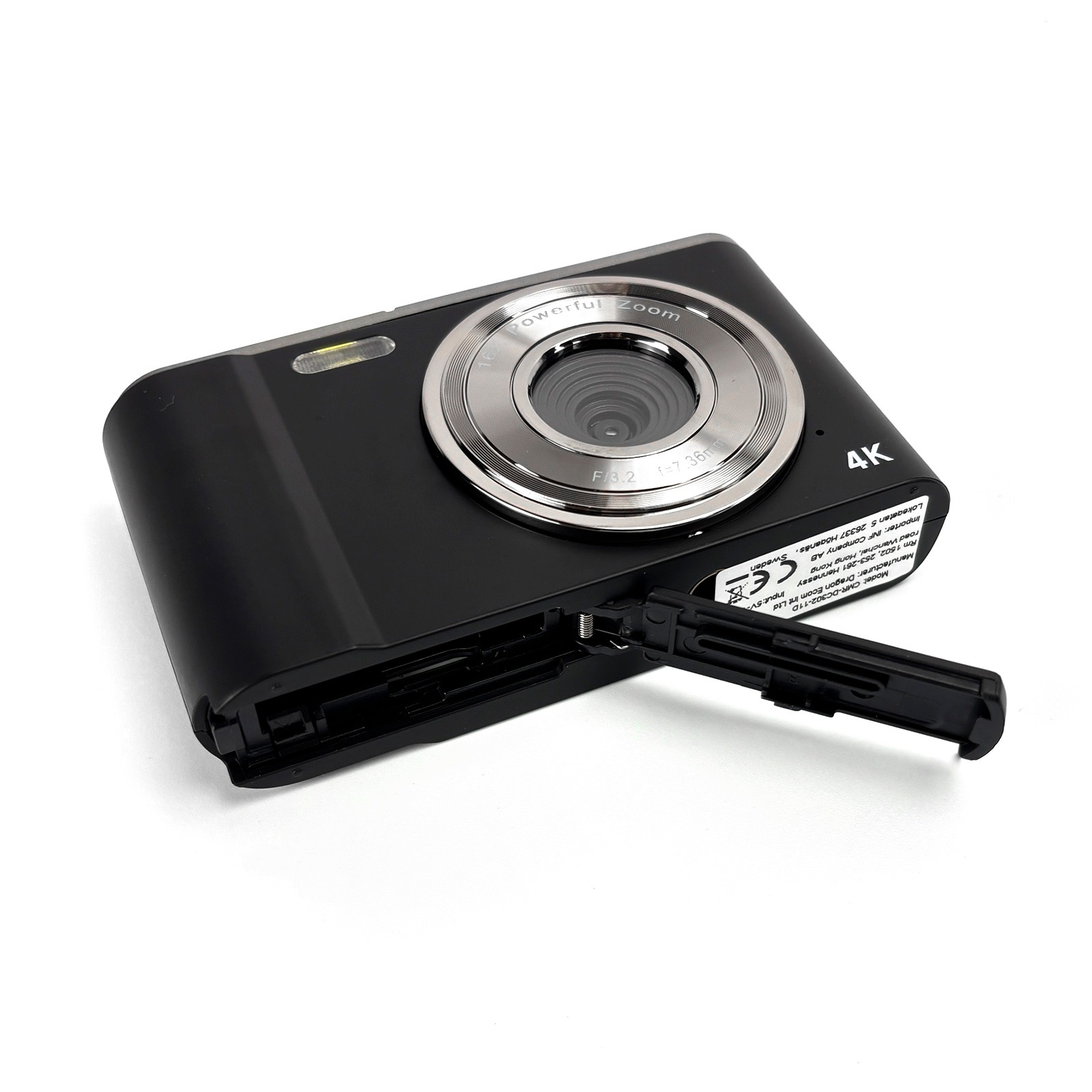 Black 4K digital camera with open compartment and silver lens ring.