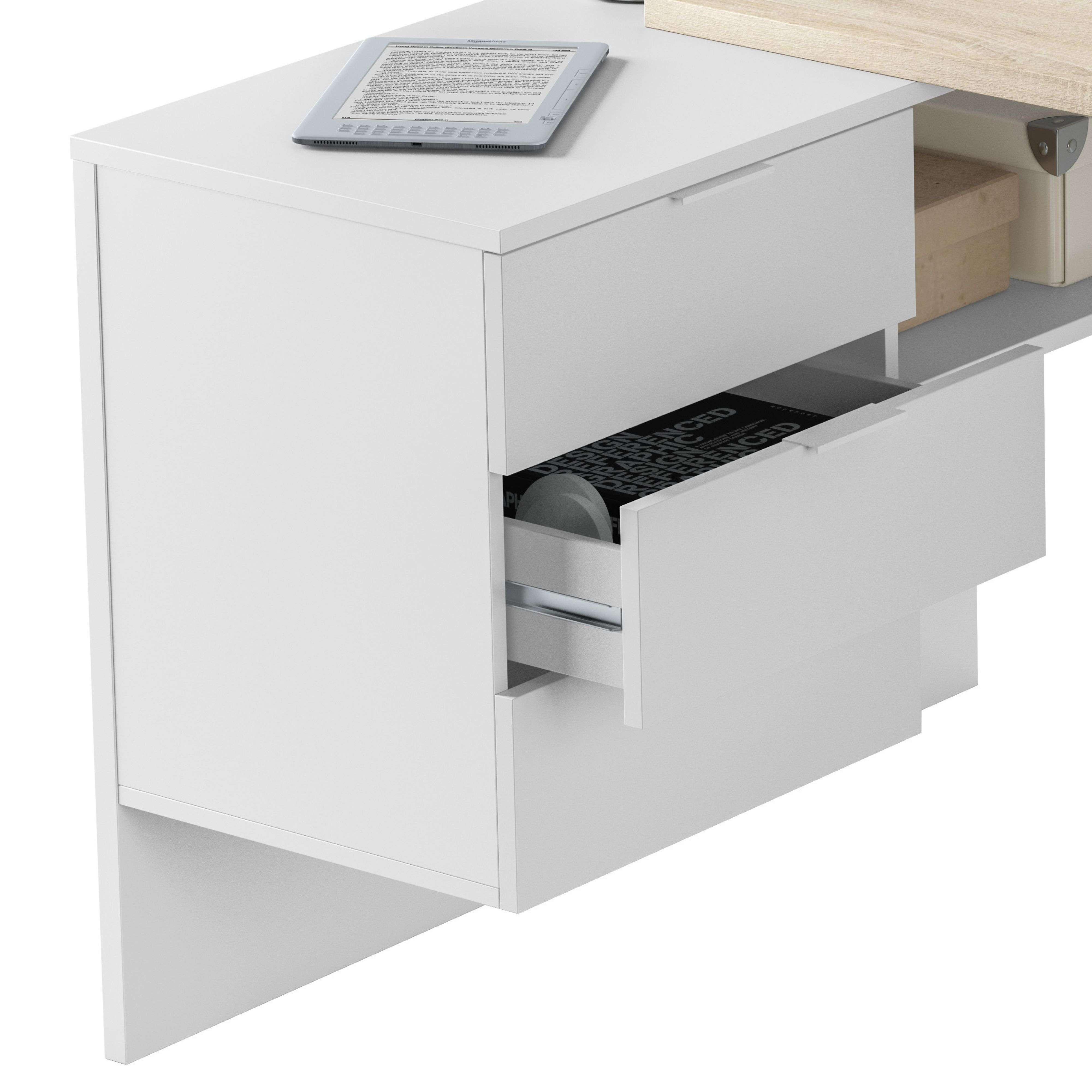 Un escritorio blanco con un cajón abierto. Un lector electrónico está encima.