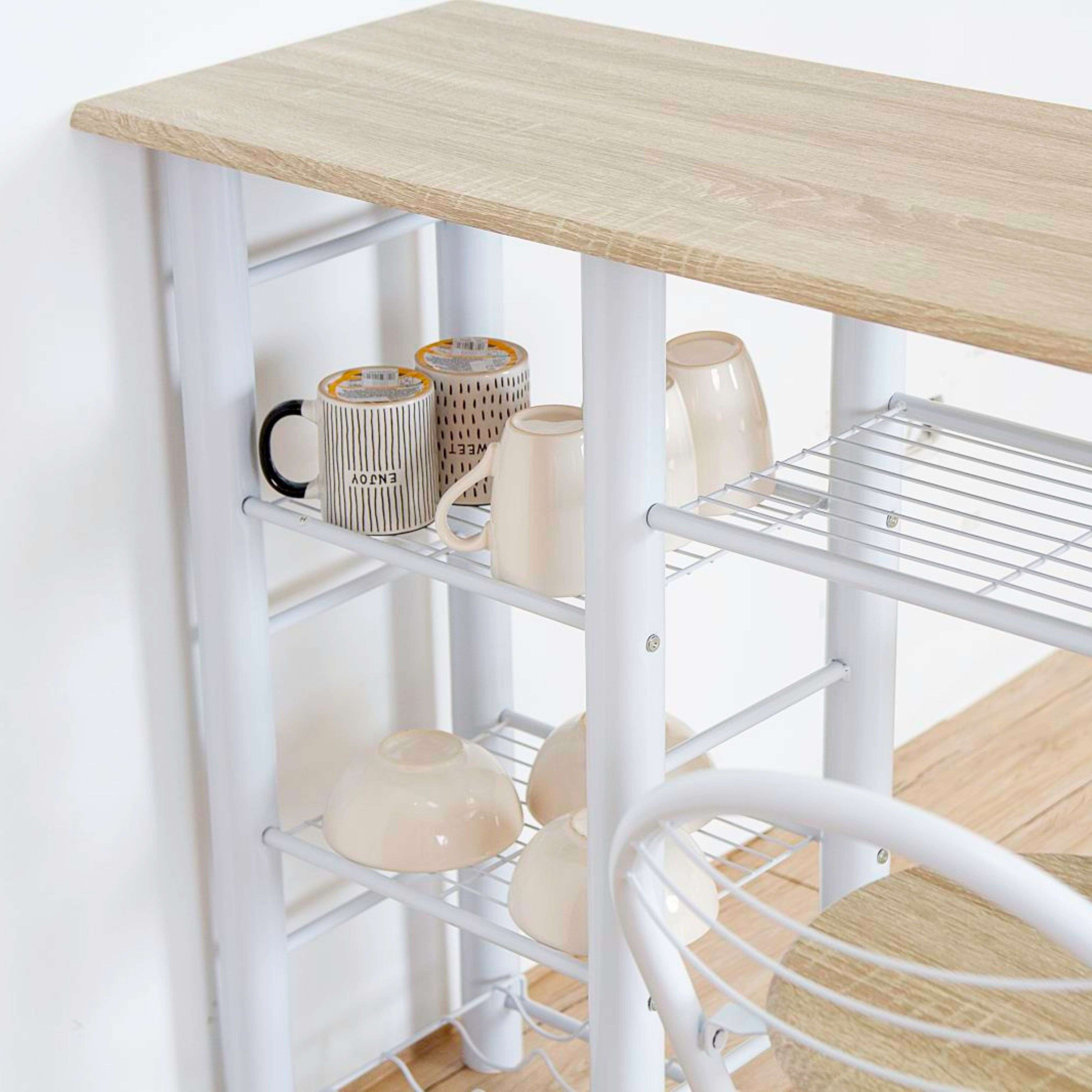 Una estantería blanca con tapa de madera, que contiene tazas y cuencos.
