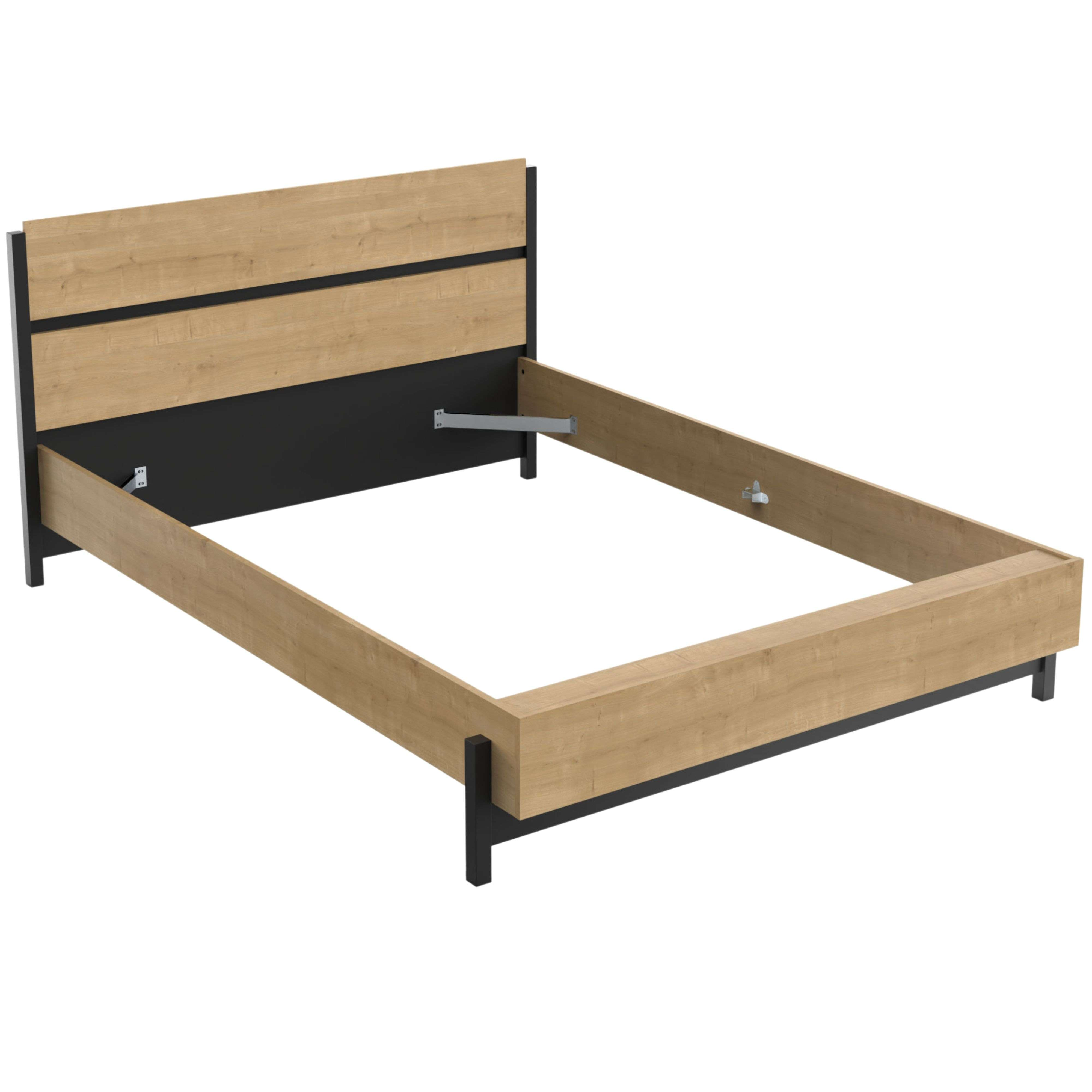 Una estructura de cama de madera y metal con cabecero.