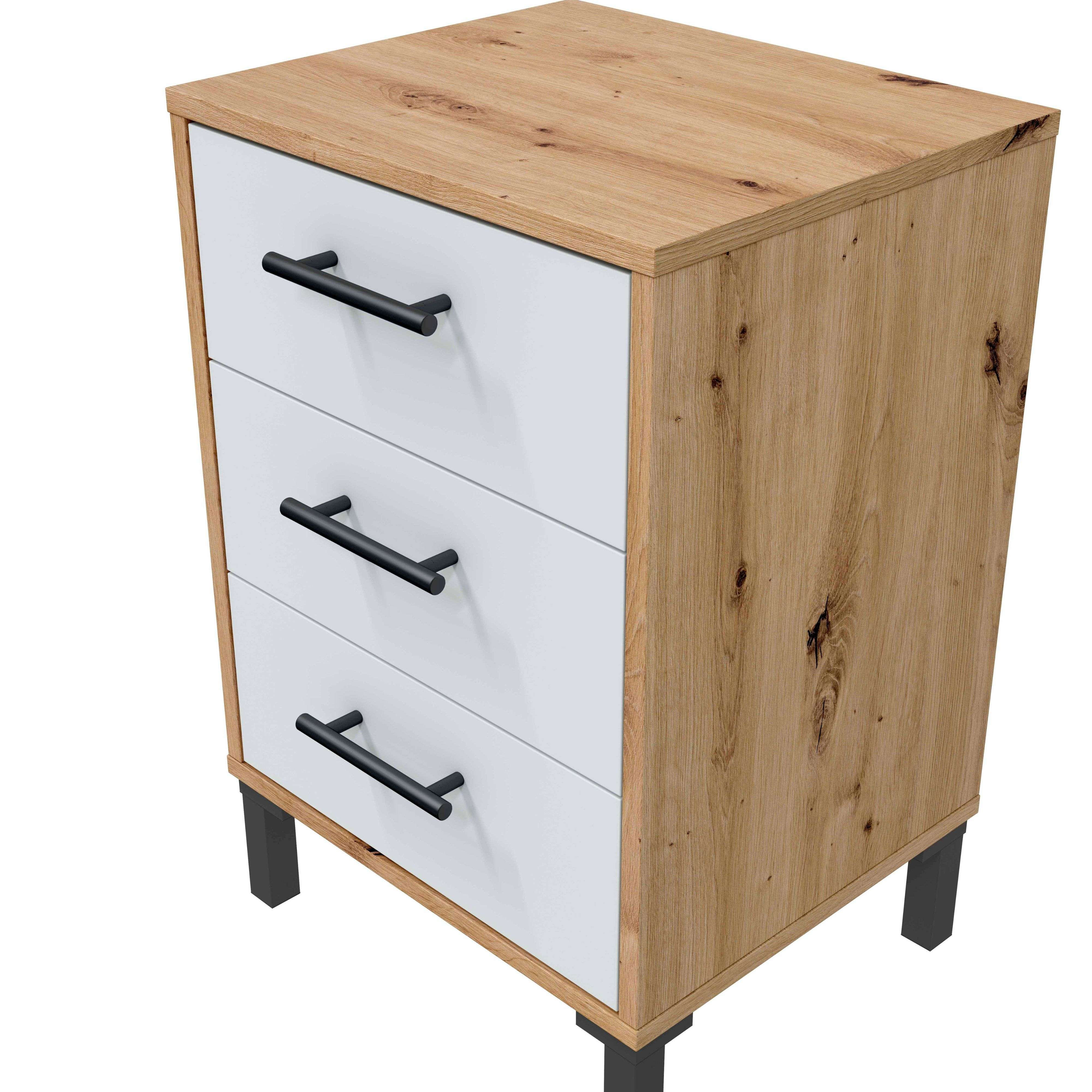 Cómoda de madera con tres cajones blancos y tiradores negros sobre patas negras.
