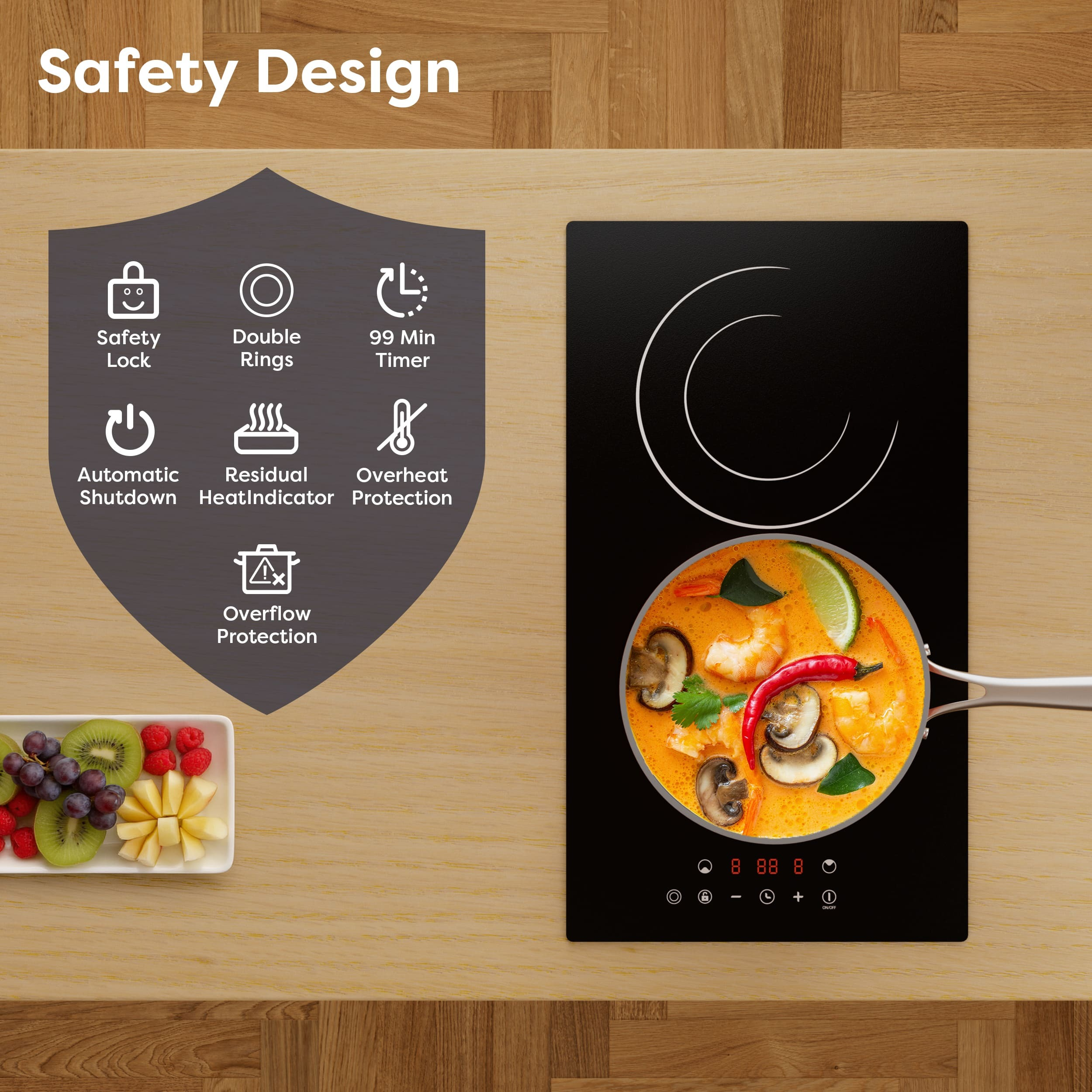 Une plaque à induction avec soupe Tom Yum, fruits et icônes de sécurité.