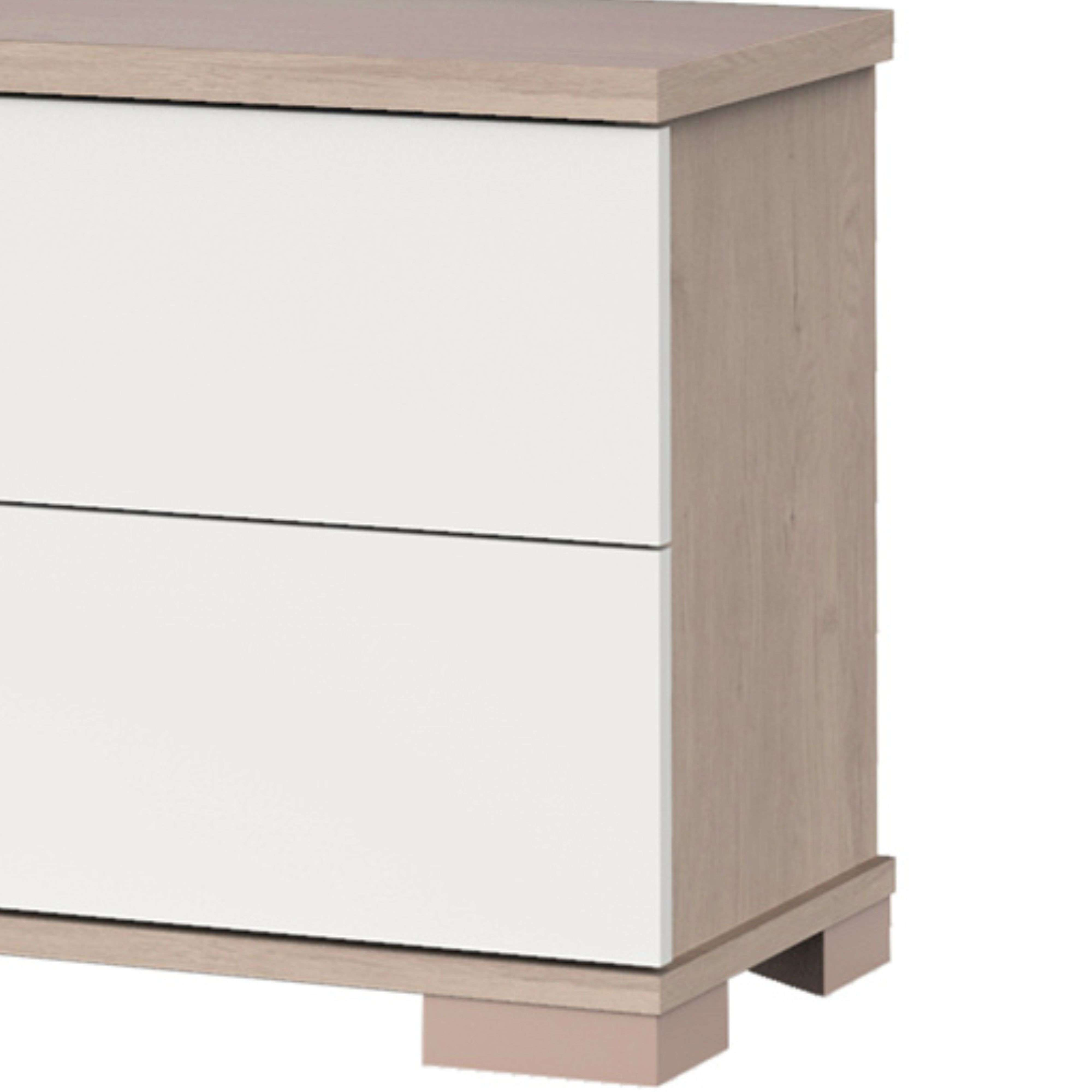 Cómoda con dos cajones blancos y laterales de madera sobre patas rosas.