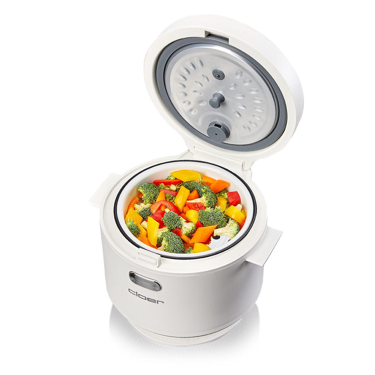 Ein weißer Dampfgarer mit offenem Deckel, gefüllt mit buntem Gemüse wie Brokkoli, Paprika und Karotten.