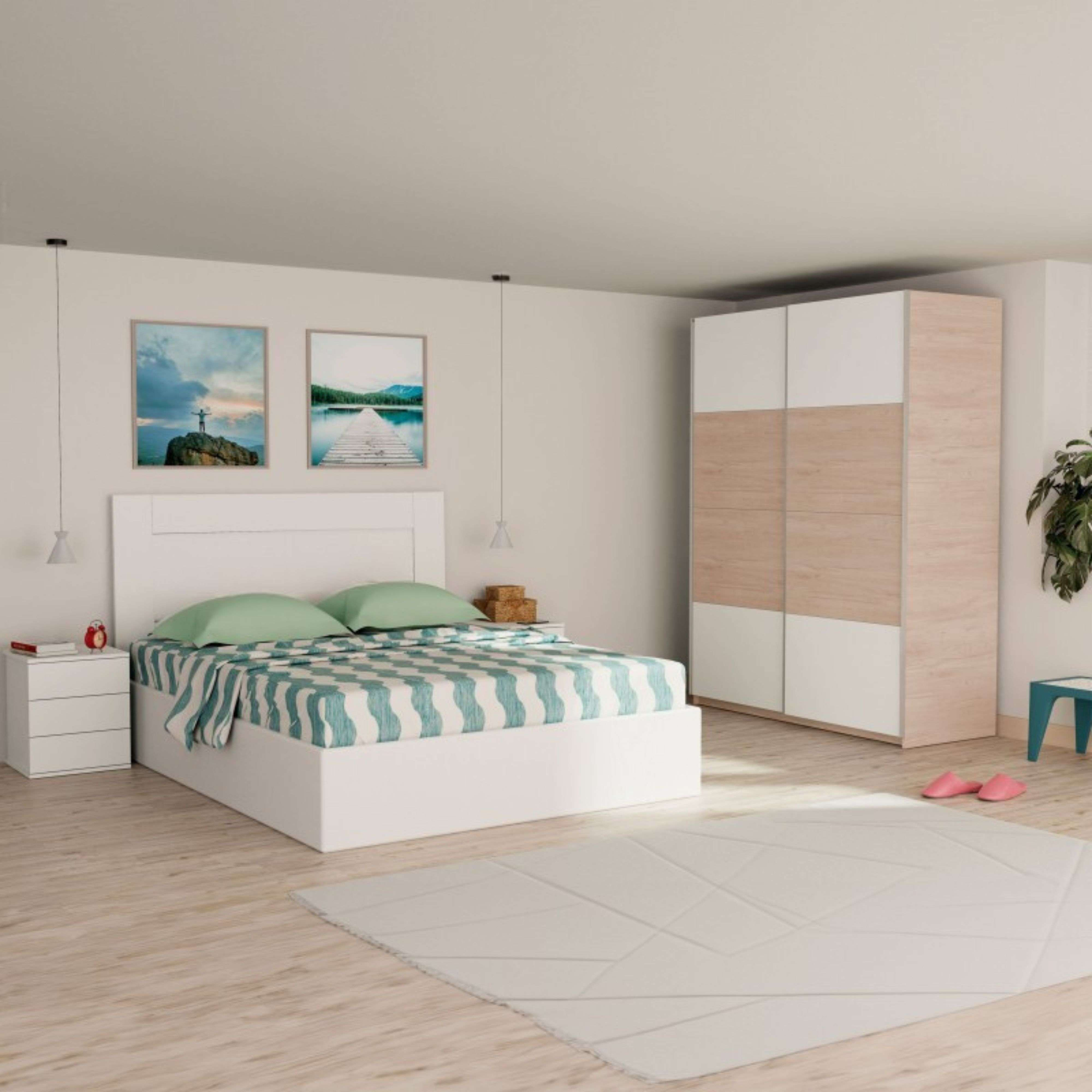 Dormitorio moderno con cama blanca, ropa de cama a rayas azules y blancas, dos mesitas de noche y un armario.
