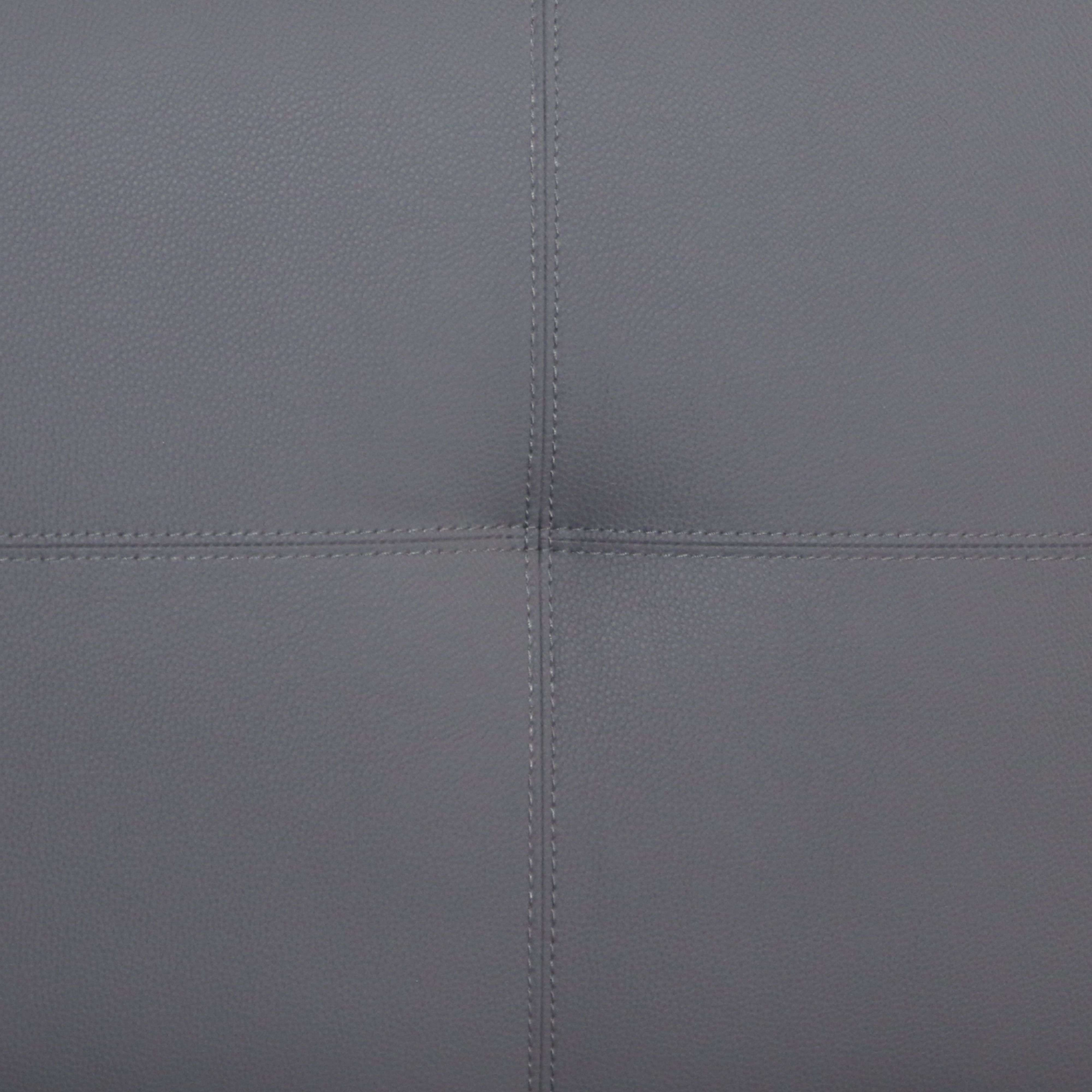 Piel sintética gris con costuras, dividida en cuatro secciones.