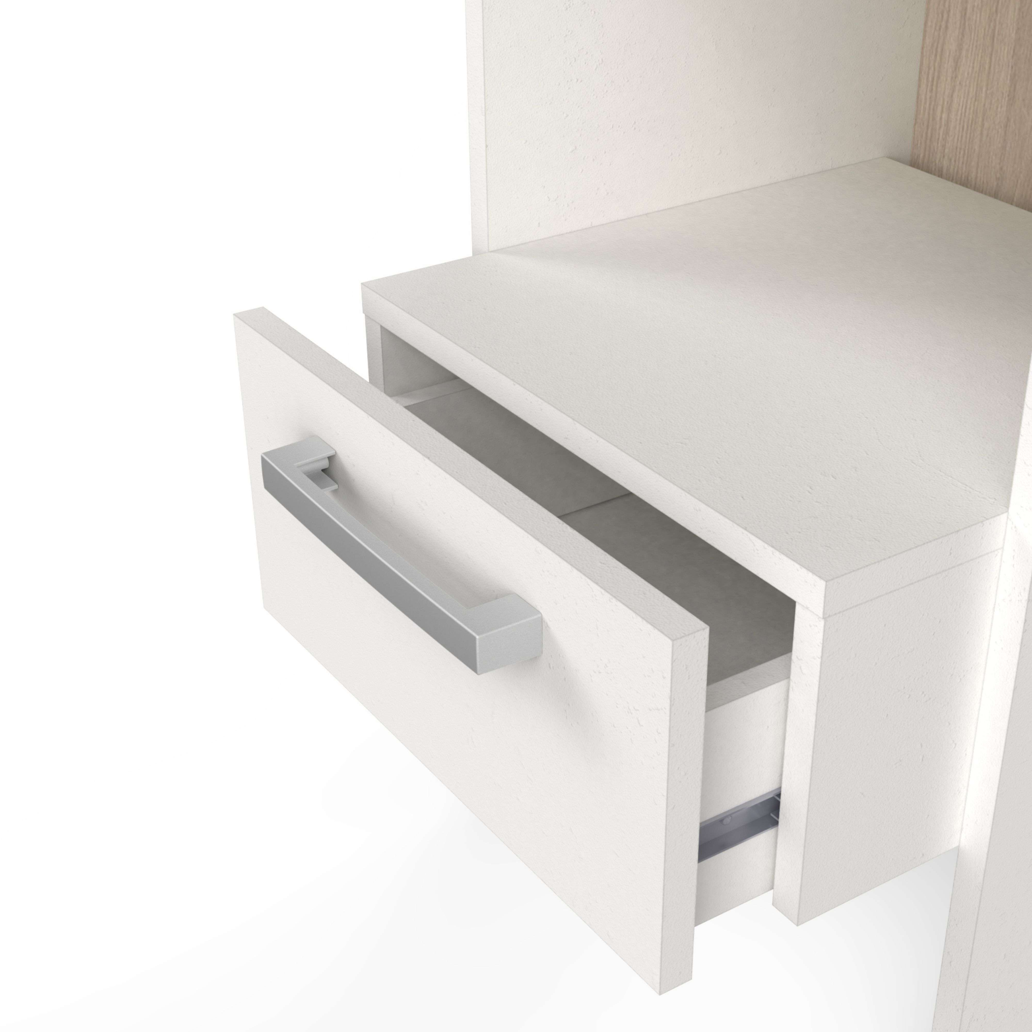 Tirador de cajón plateado extraído en un mueble blanco.