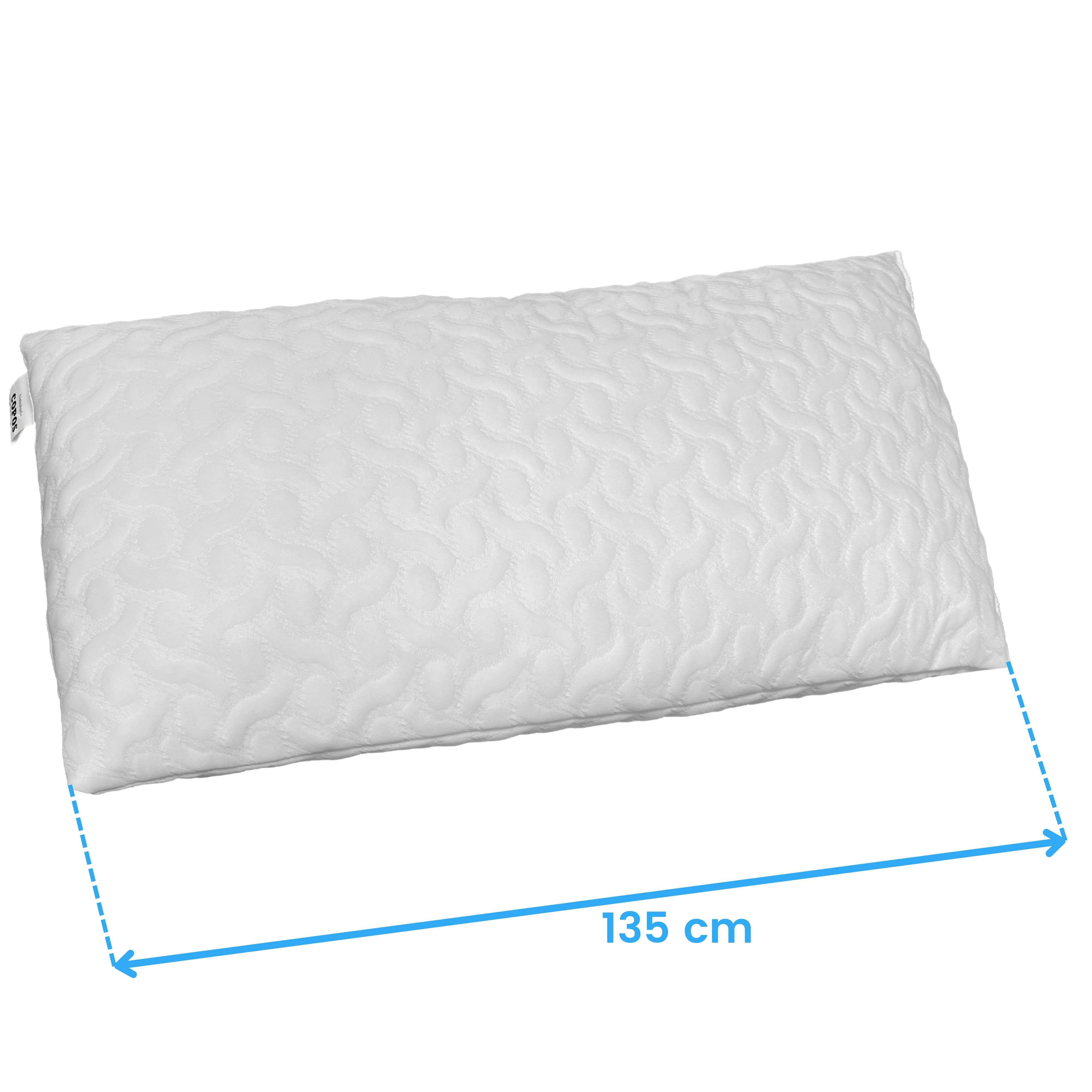 Almohada blanca con patrón ondulado, 135 cm de largo.