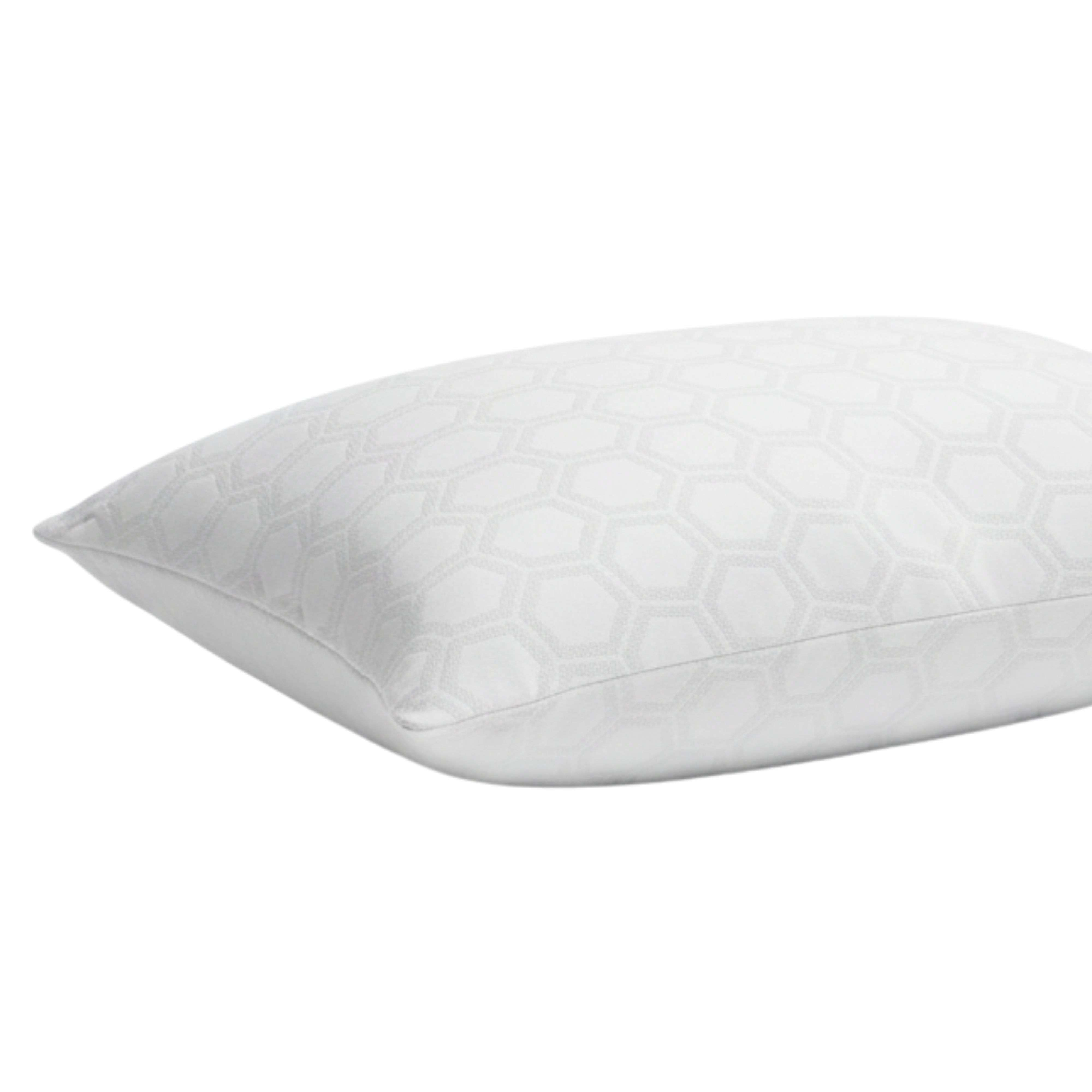 Almohada blanca con patrón hexagonal.
