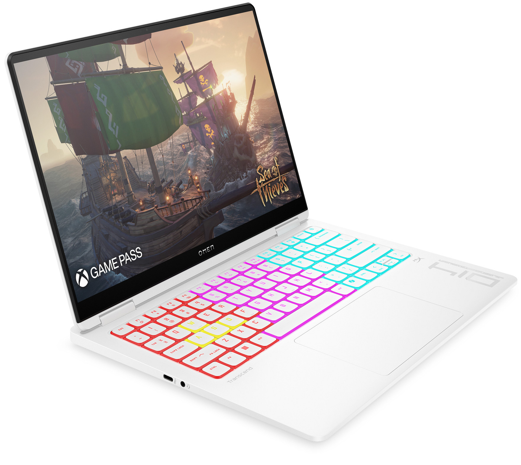 Ein weißer Laptop zeigt das Spiel „Sea of Thieves“ mit Schiffen und Piratenflaggen bei Sonnenuntergang.