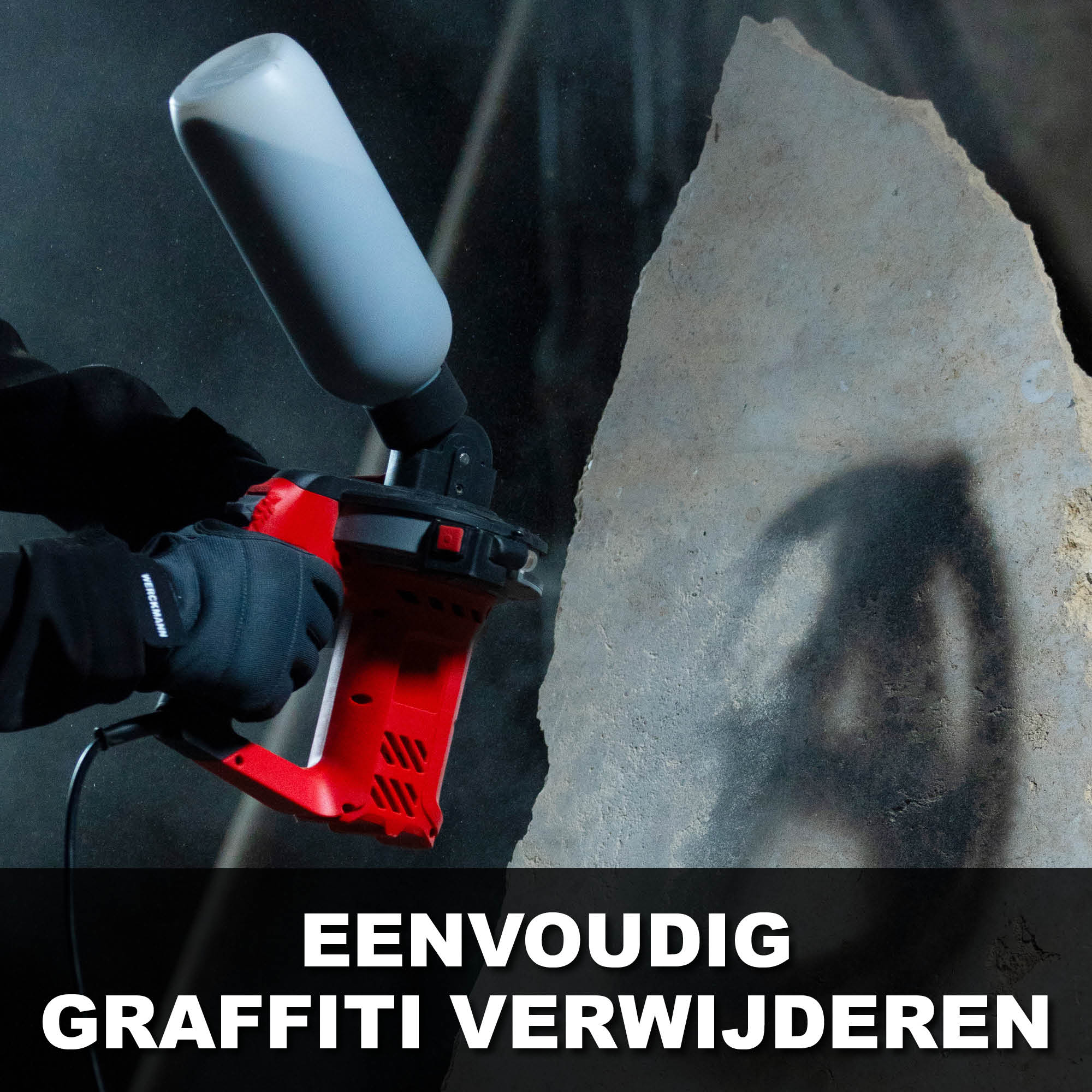 Person in black gloves uses a red graffiti removal tool on a concrete wall.