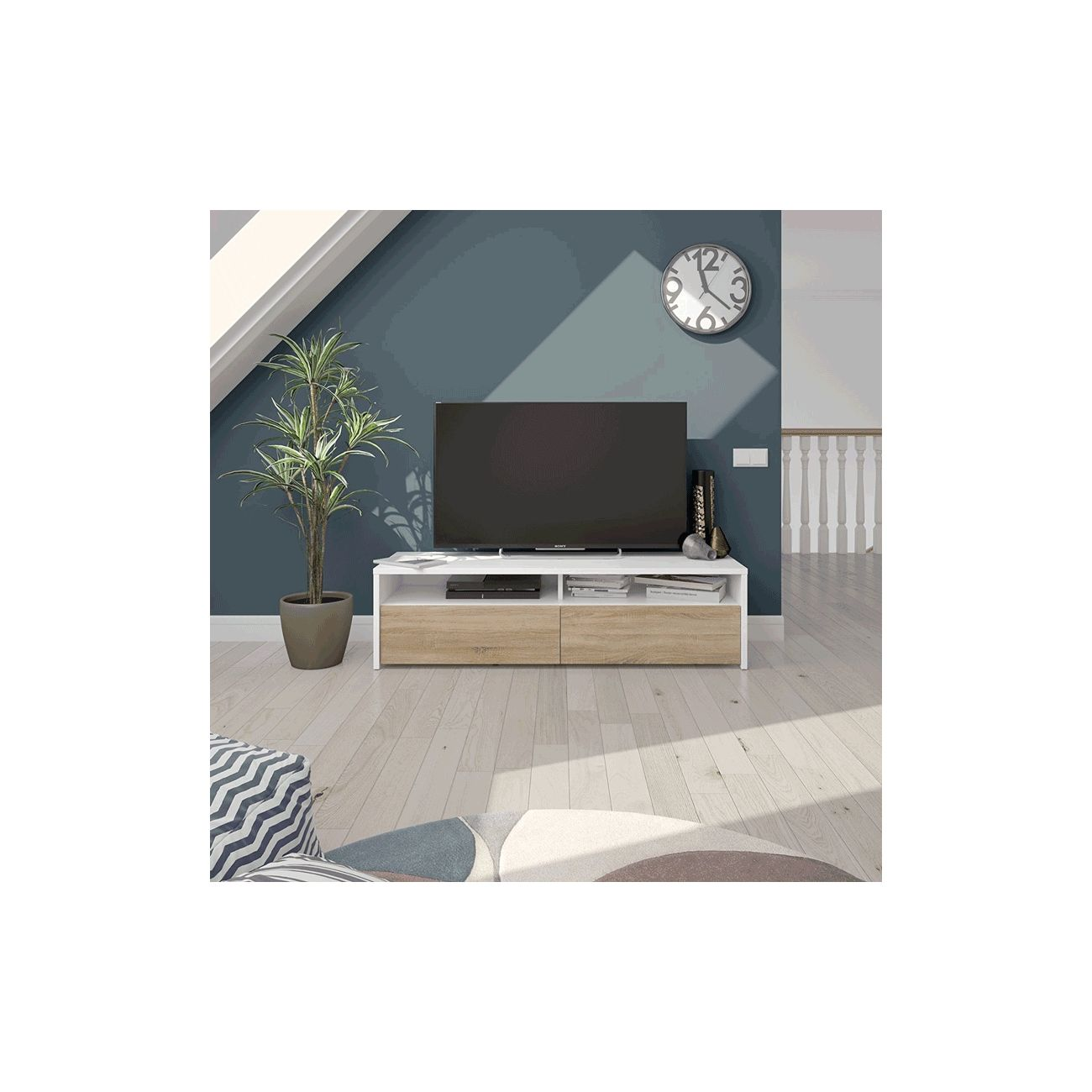 Un mueble de TV con dos cajones, un televisor grande y una planta.