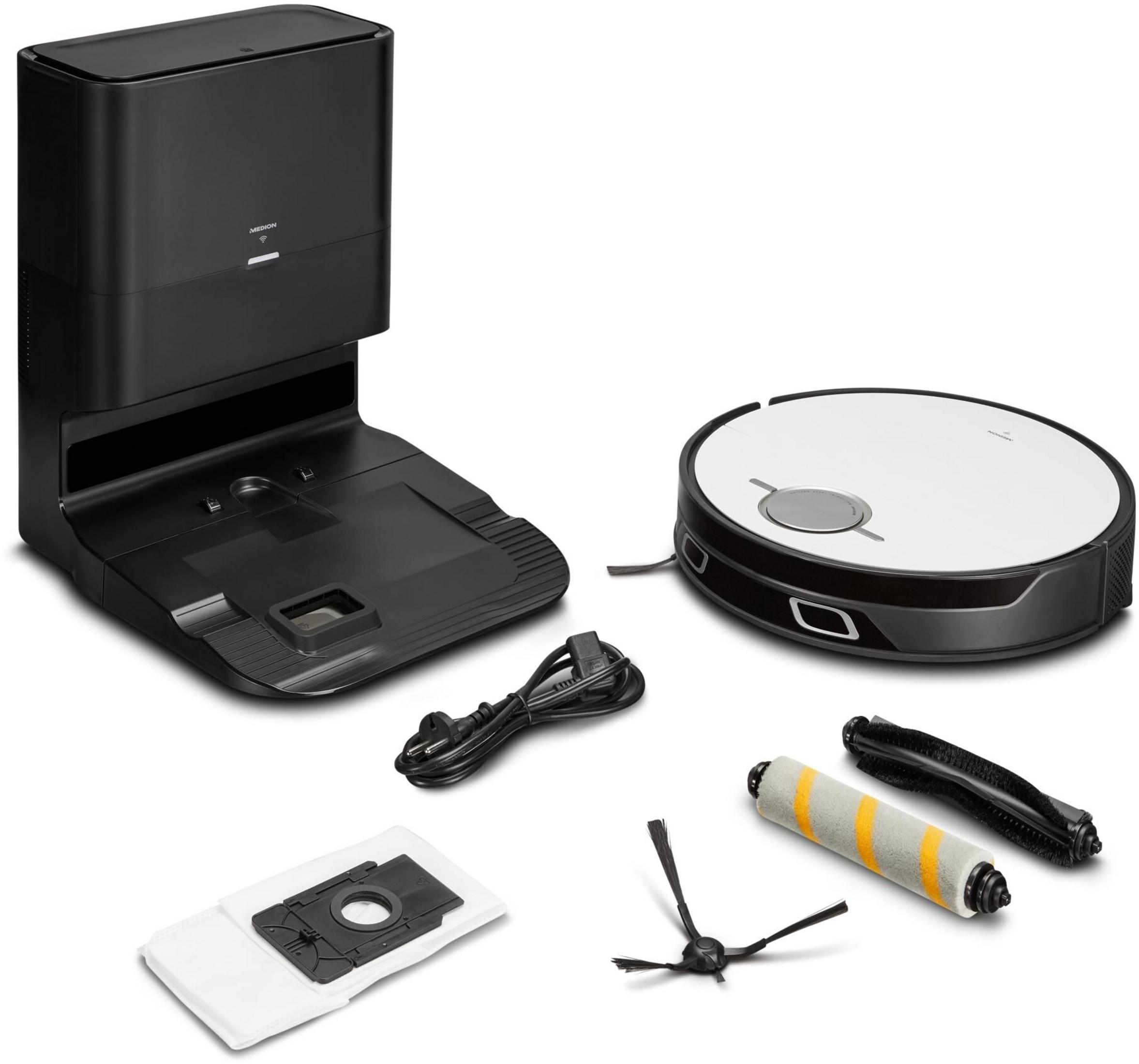 Un aspirateur robot noir avec accessoires, dont une station de charge et des brosses de rechange.
