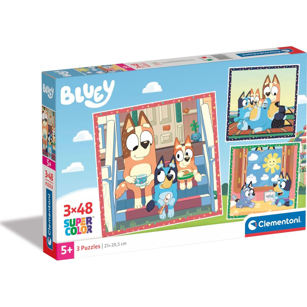 Emballage de puzzle Bluey avec la famille de chiens dans les escaliers et à l'extérieur.
