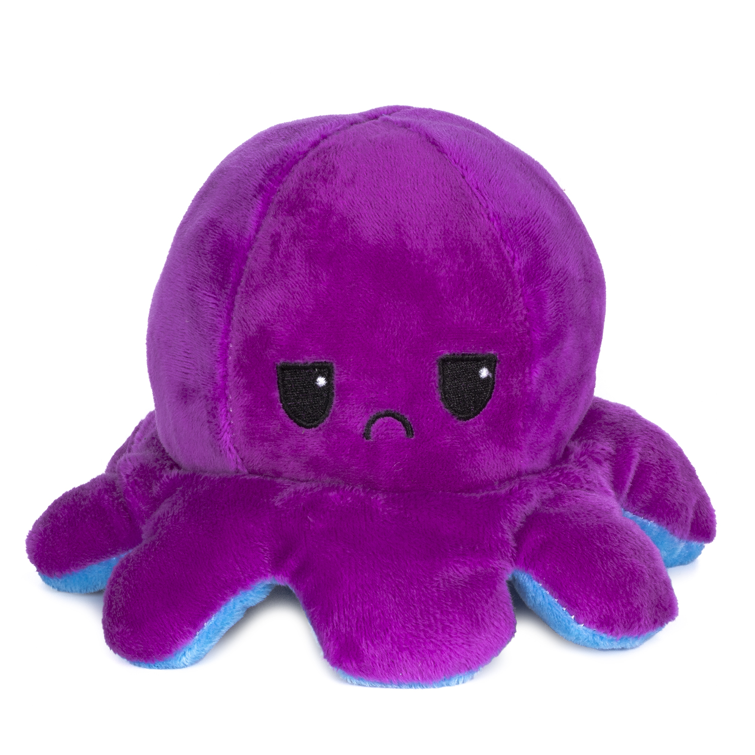 Un pulpo de peluche morado y azul con cara triste.